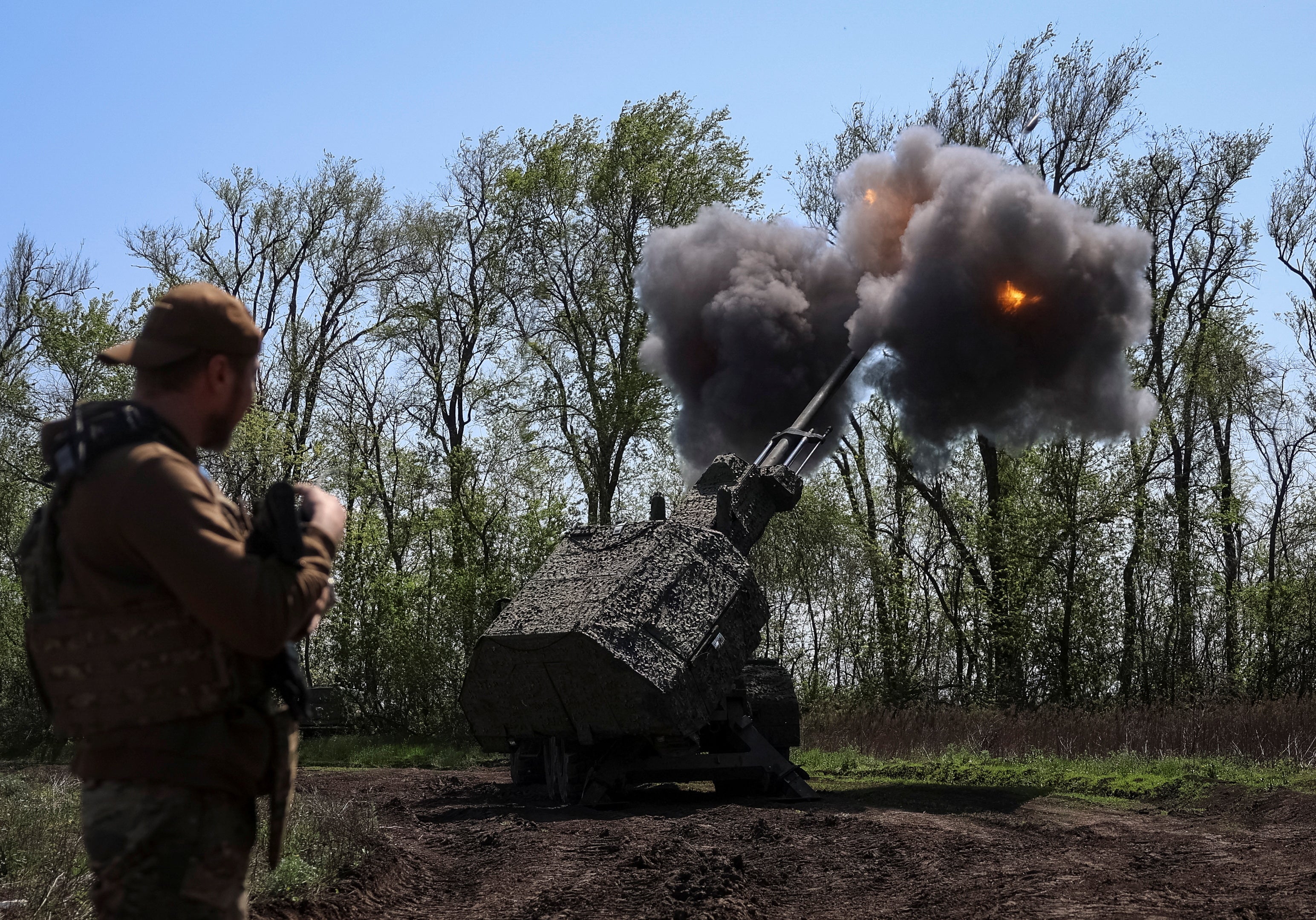 Ukrainian servicemen fire an Archer self-propelled howitzer towards Russian troops at a position in Zaporizhzhia region