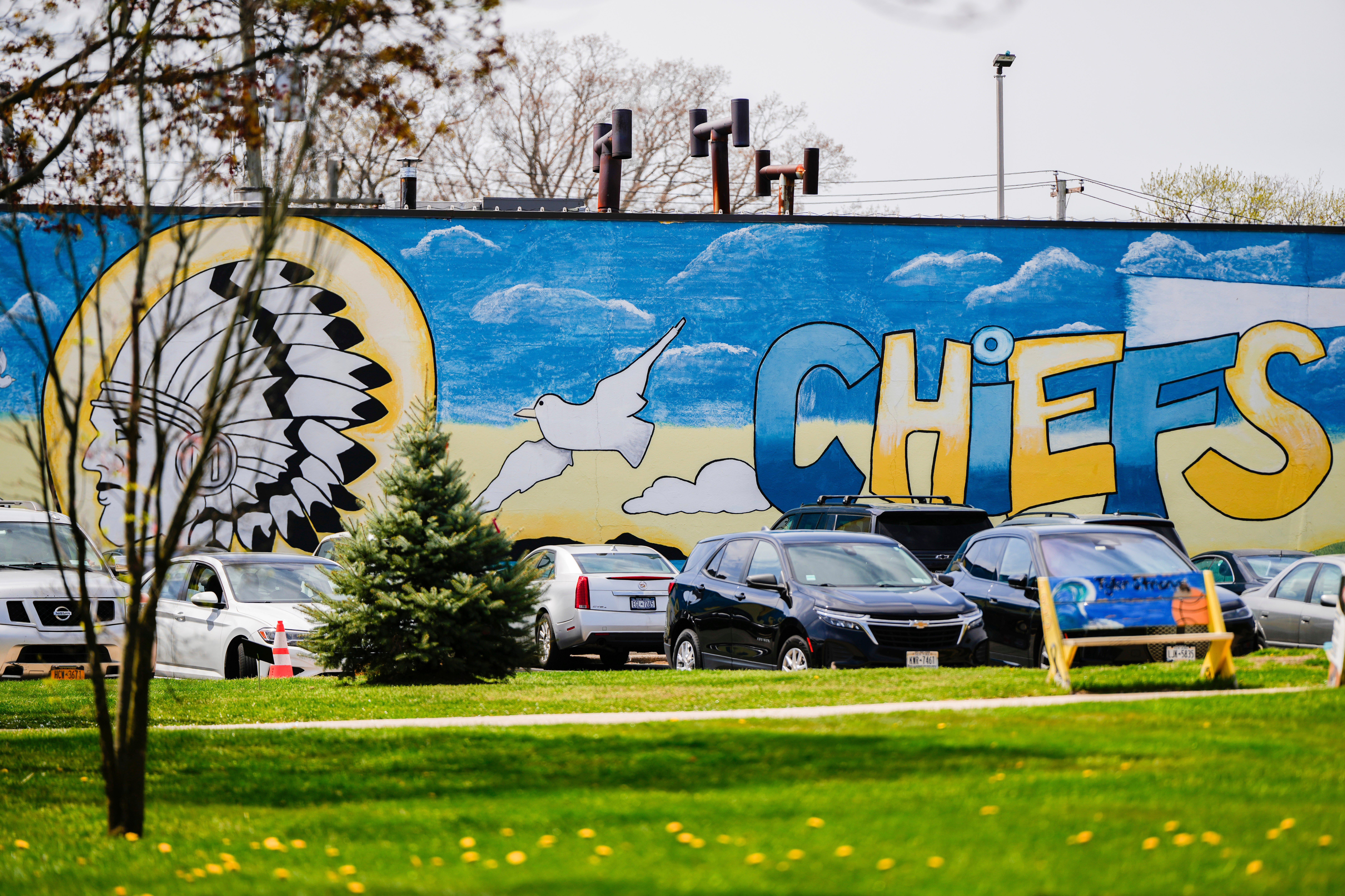 A mural adorns a wall next to the Massapequa High School, in Massapequa, N.Y., Friday, April 25, 2025. (AP Photo/Julia Demaree Nikhinson)