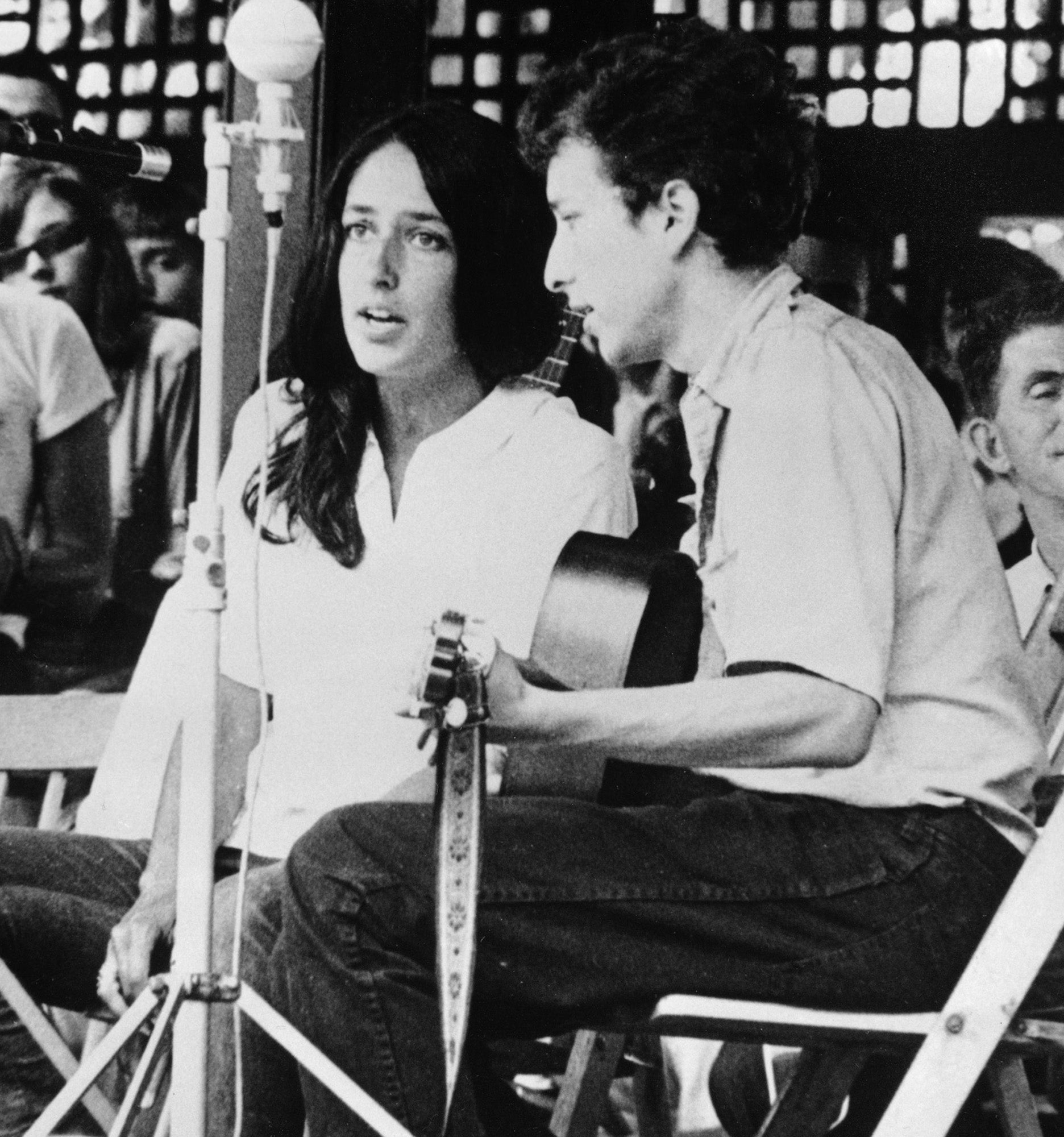 Joan Baez and Bob Dylan pictured in 1963 performing at the Newport Folk Festival