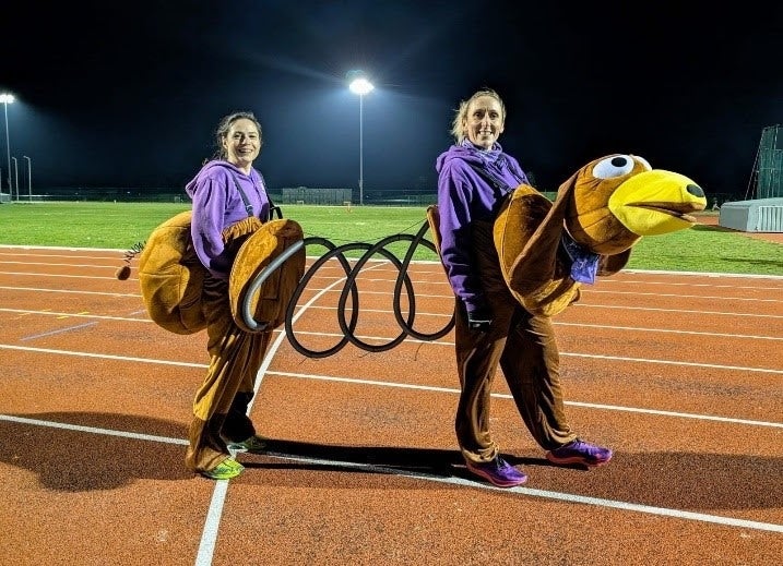 Chris Buckle and Emma Moreton dressed as a slinky dog (Guinness World Records/PA)
