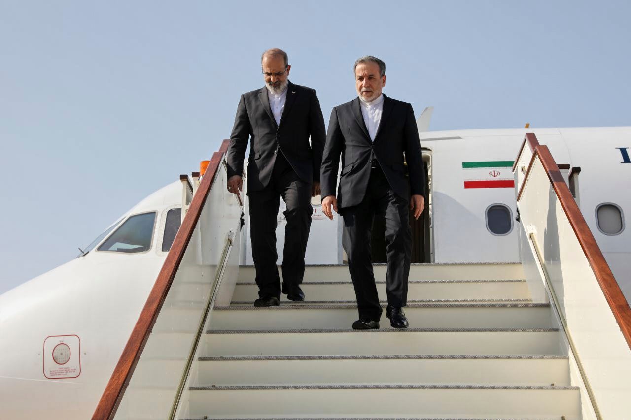 Iranian foreign minister Abbas Araghchi, right, walks down from his plane as he arrives for talks with US Mideast envoy Steve Witkoff in Muscat, Oman, on 25 April 2025