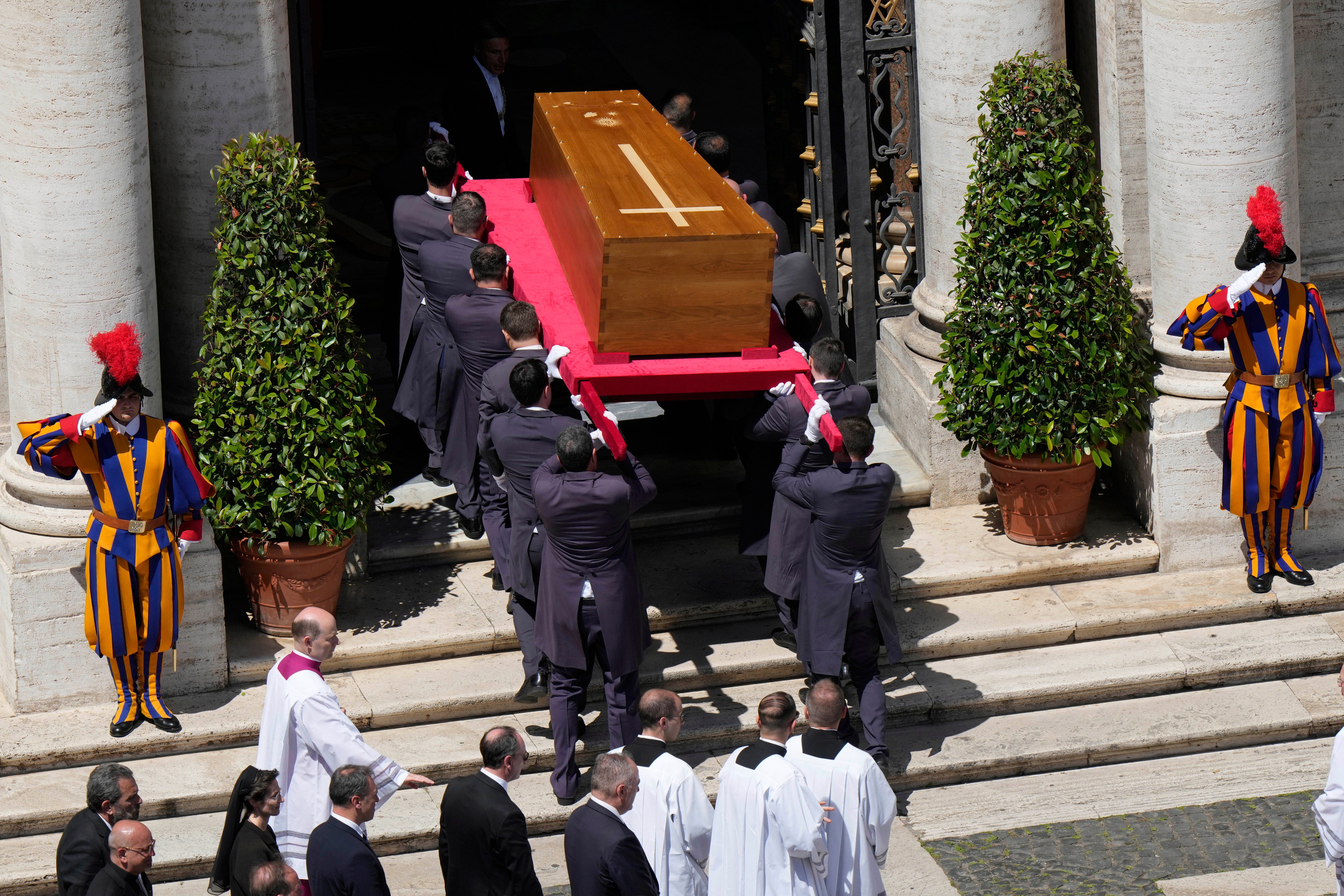 The coffin is carried into St Mary Major Basilica