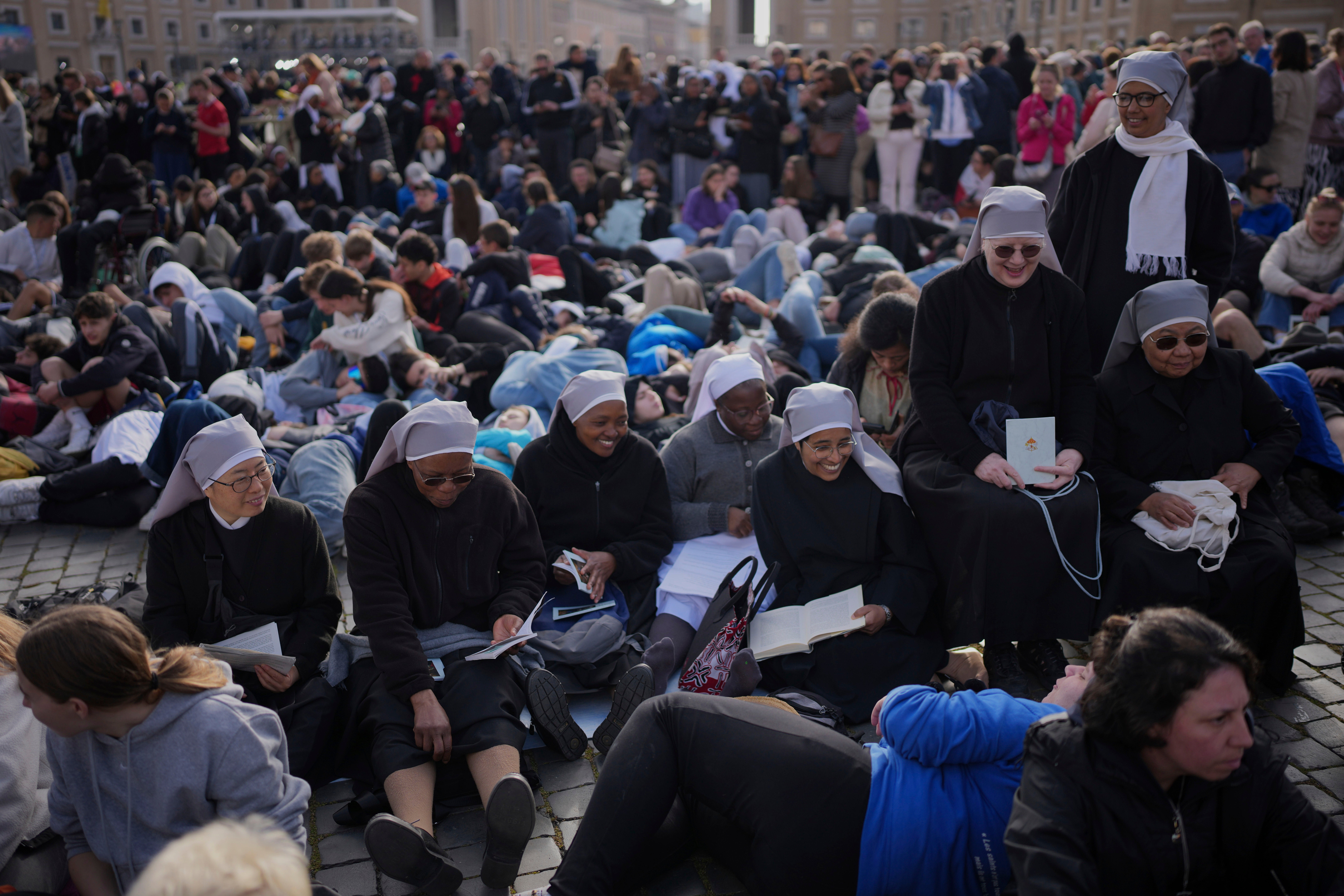 Nuns sat in St Peter's Square waiting for the funeral of Pope Francis to begin