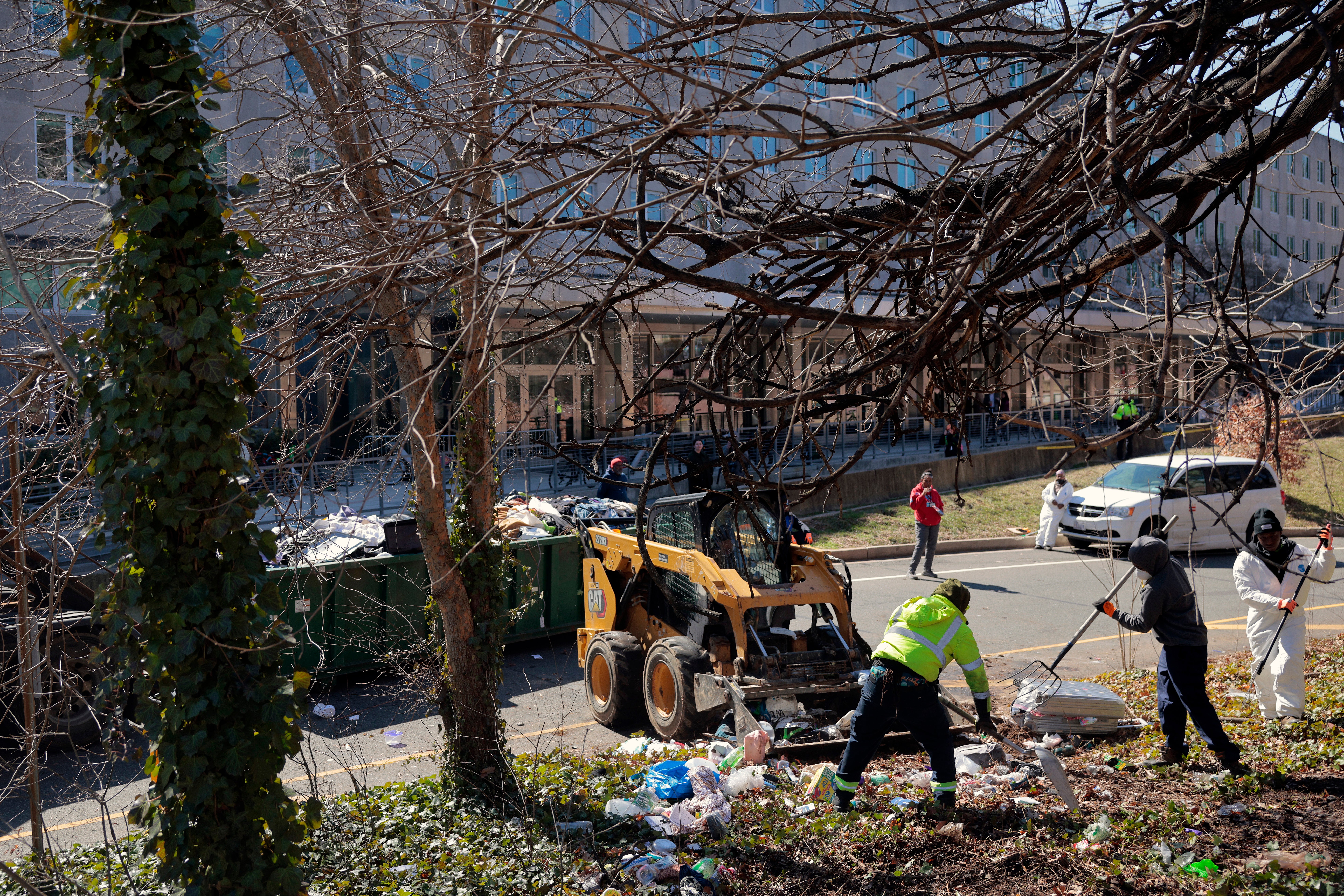 Washington, D.C., city officials and law enforcement clear out a homeless encampment near the State Department on March 07, 2025