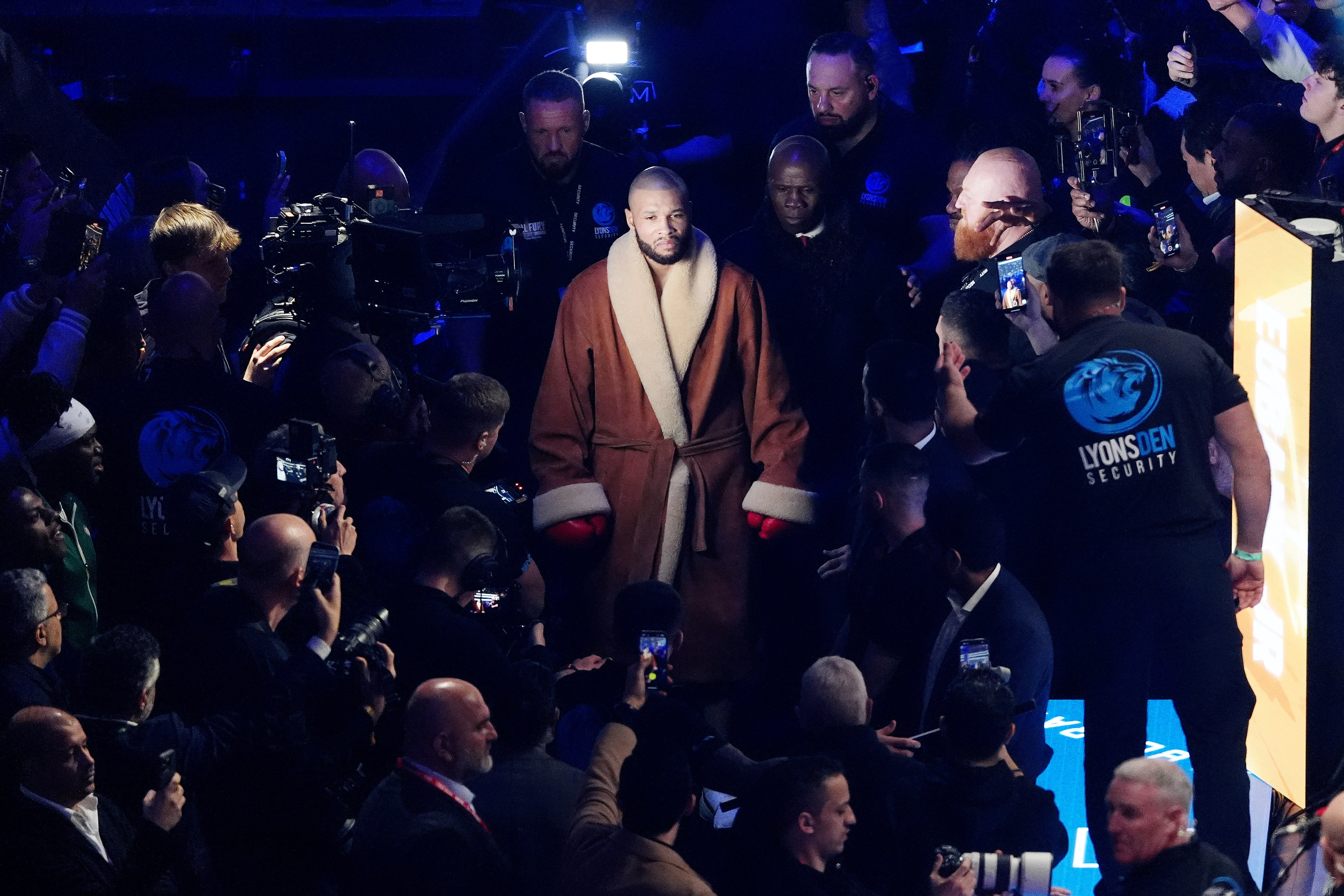 Chris Eubank Jr and Sr walk to the ring in Tottenham Hotspur Stadium