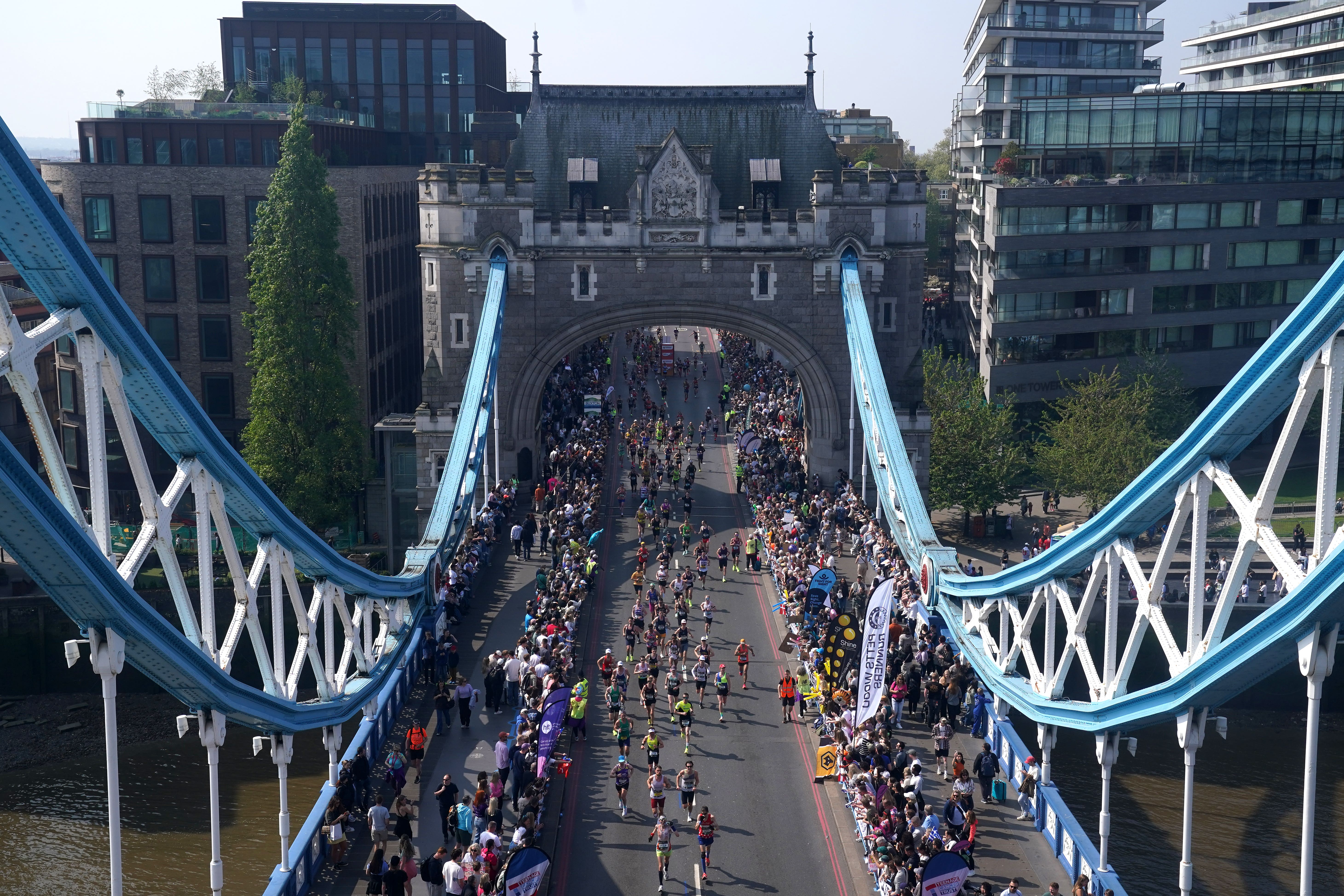 Runners in the mass participation race on Tower Bridge during the TCS London Marathon (Jonathan Brady/PA)