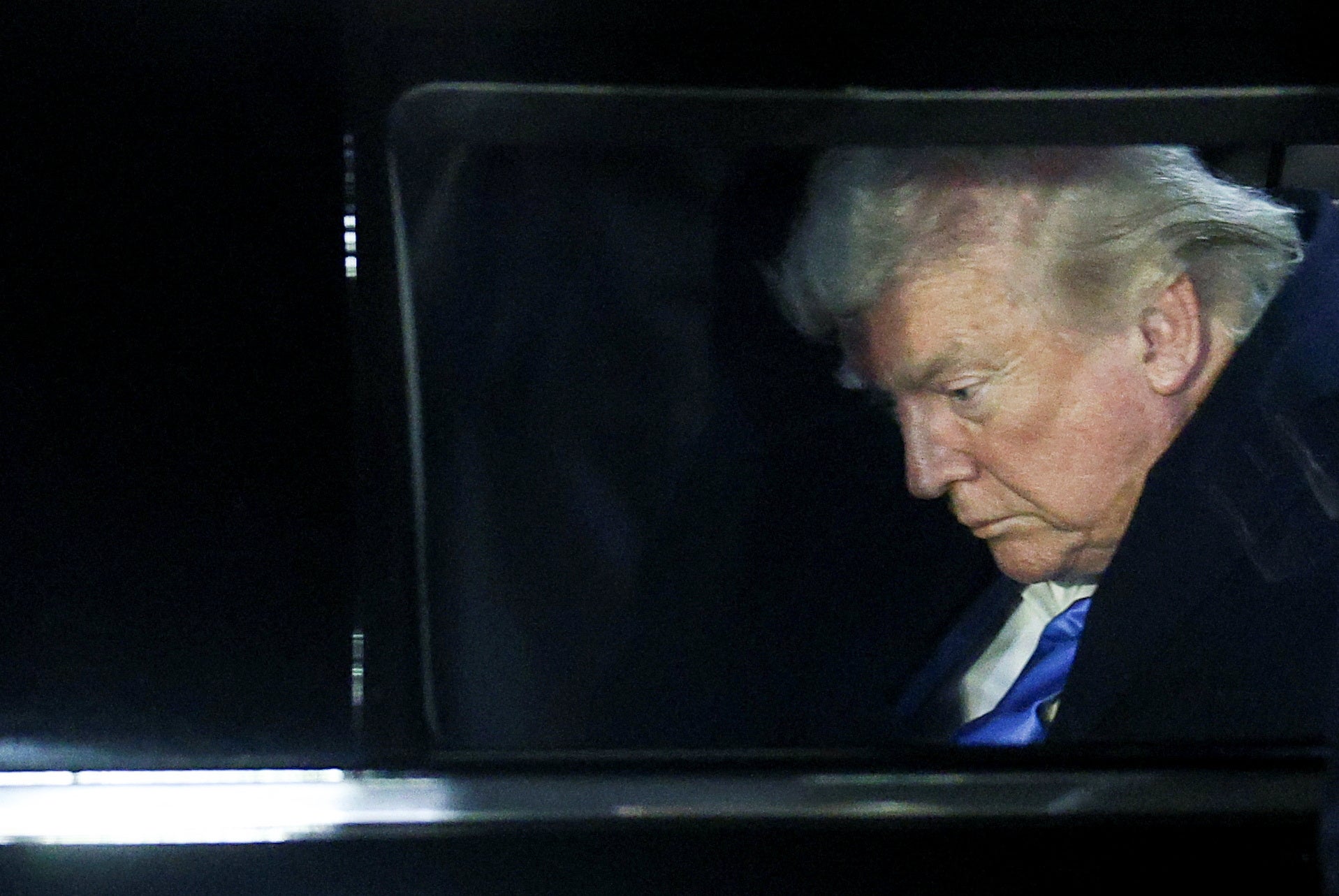 President Donald Trump sits inside a vehicle upon arrival at Fiumicino Airport to attend the funeral of Pope Francis near Rome