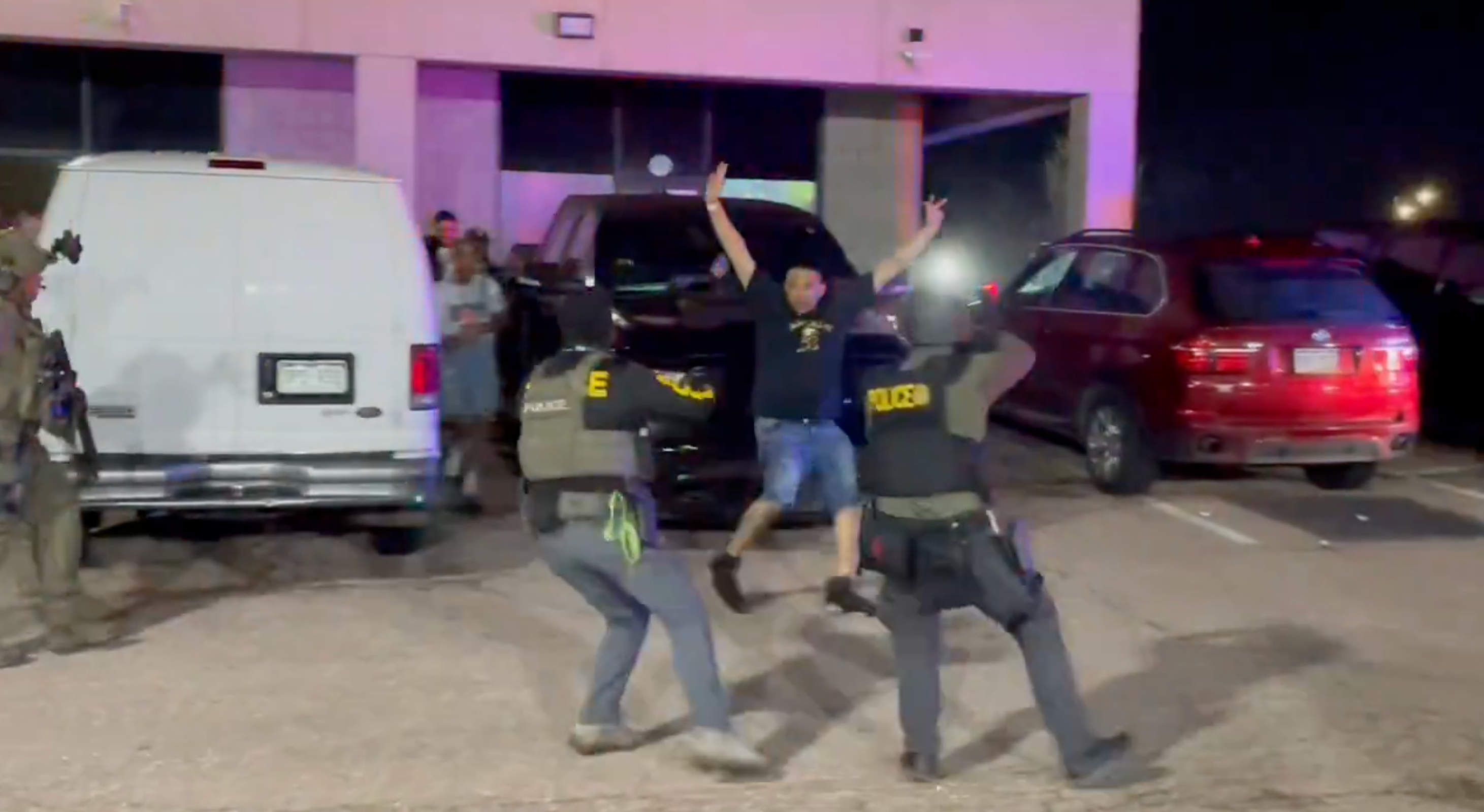 Dozens of people streamed out of the ‘underground nightclub’ as federal agents conducted their nighttime raid