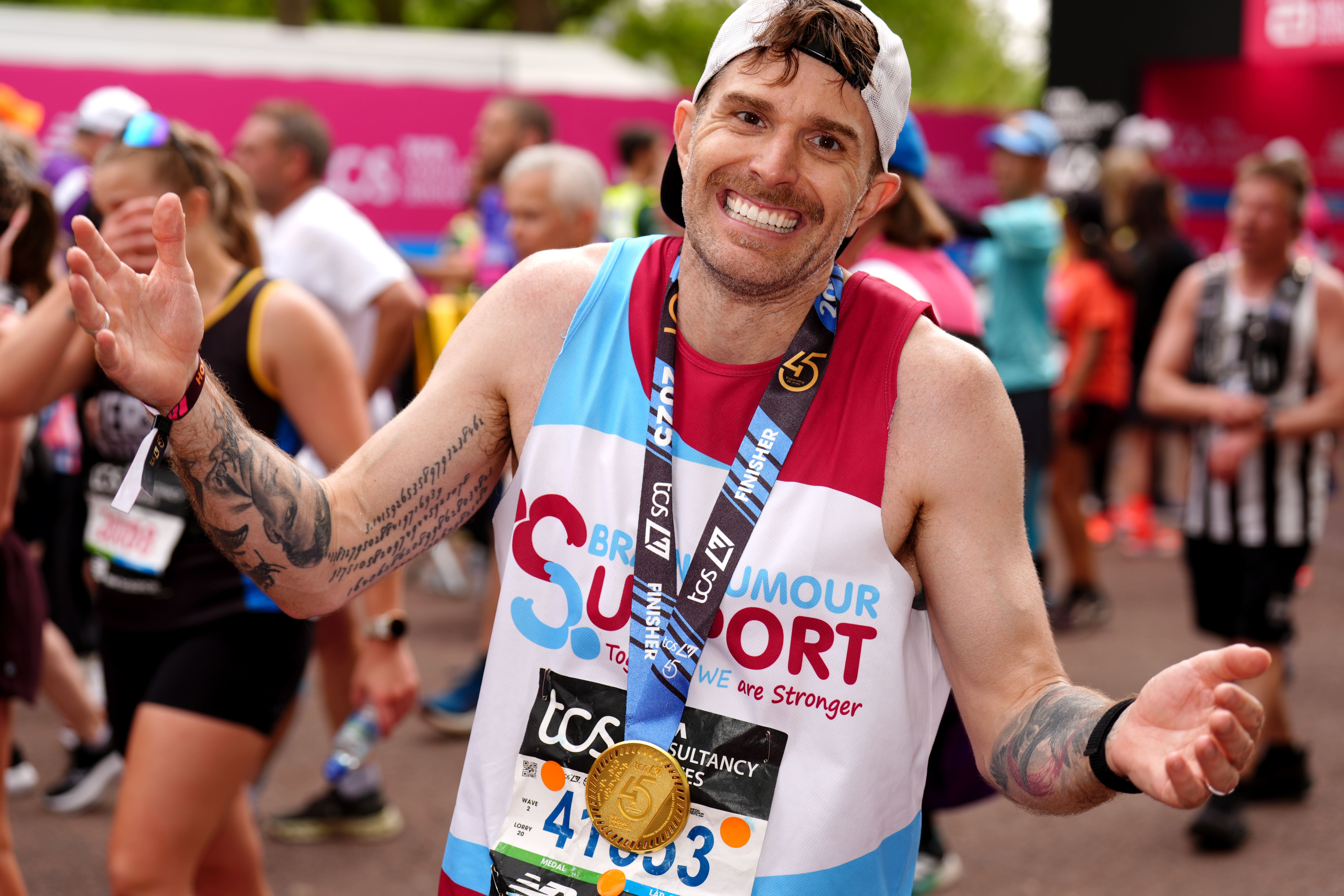 Joel Dommett after crossing the finish line during the TCS London Marathon (John Walton/PA)