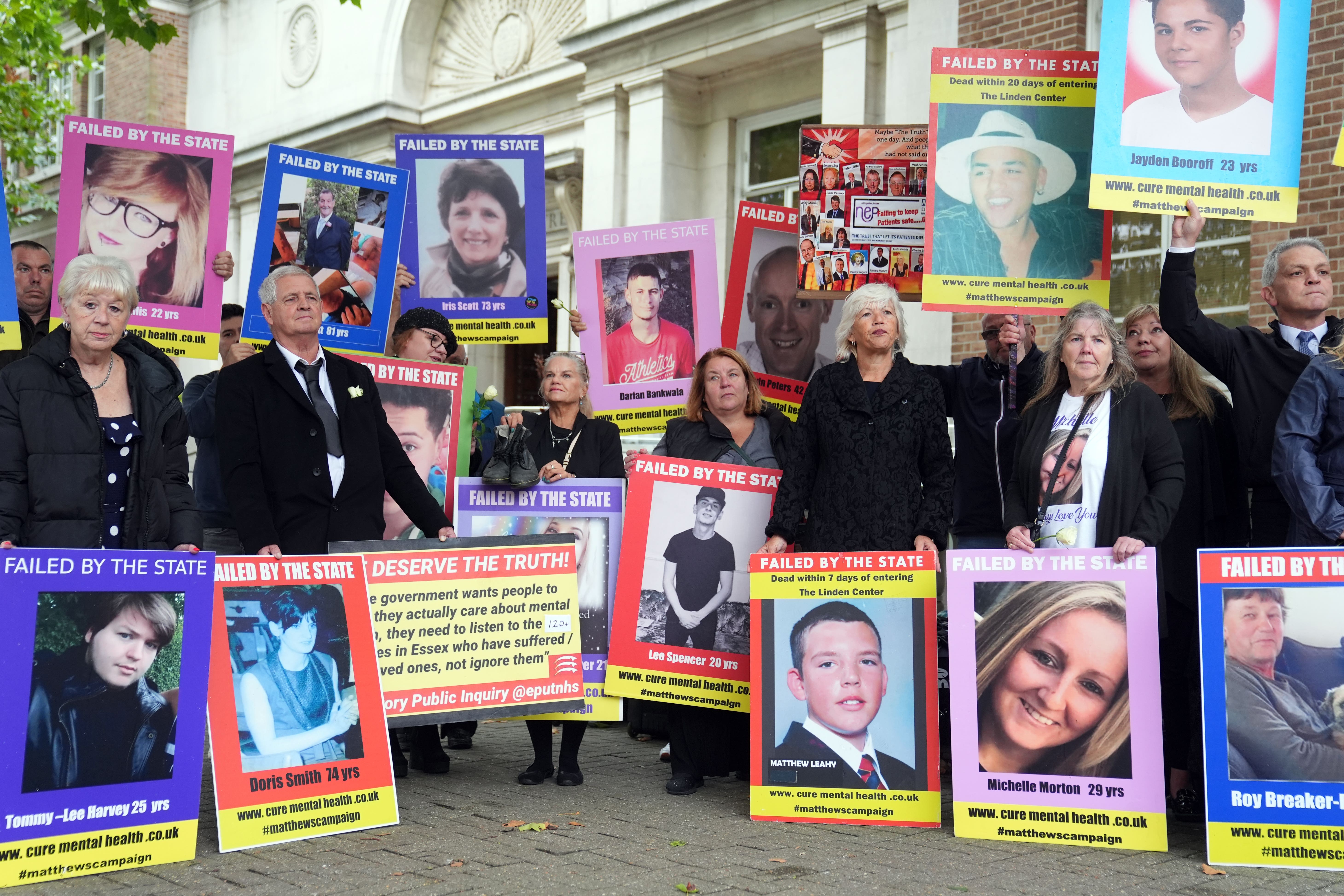 Family members of those lost after receiving treatment for mental health concerns hold up pictures during a protest at the Lampard Inquiry at Chelmsford Civic Centre last year. The inquiry is investigating deaths of mental health inpatients in Essex between 2000 and 2023. Picture date: Monday September 9, 2024.
