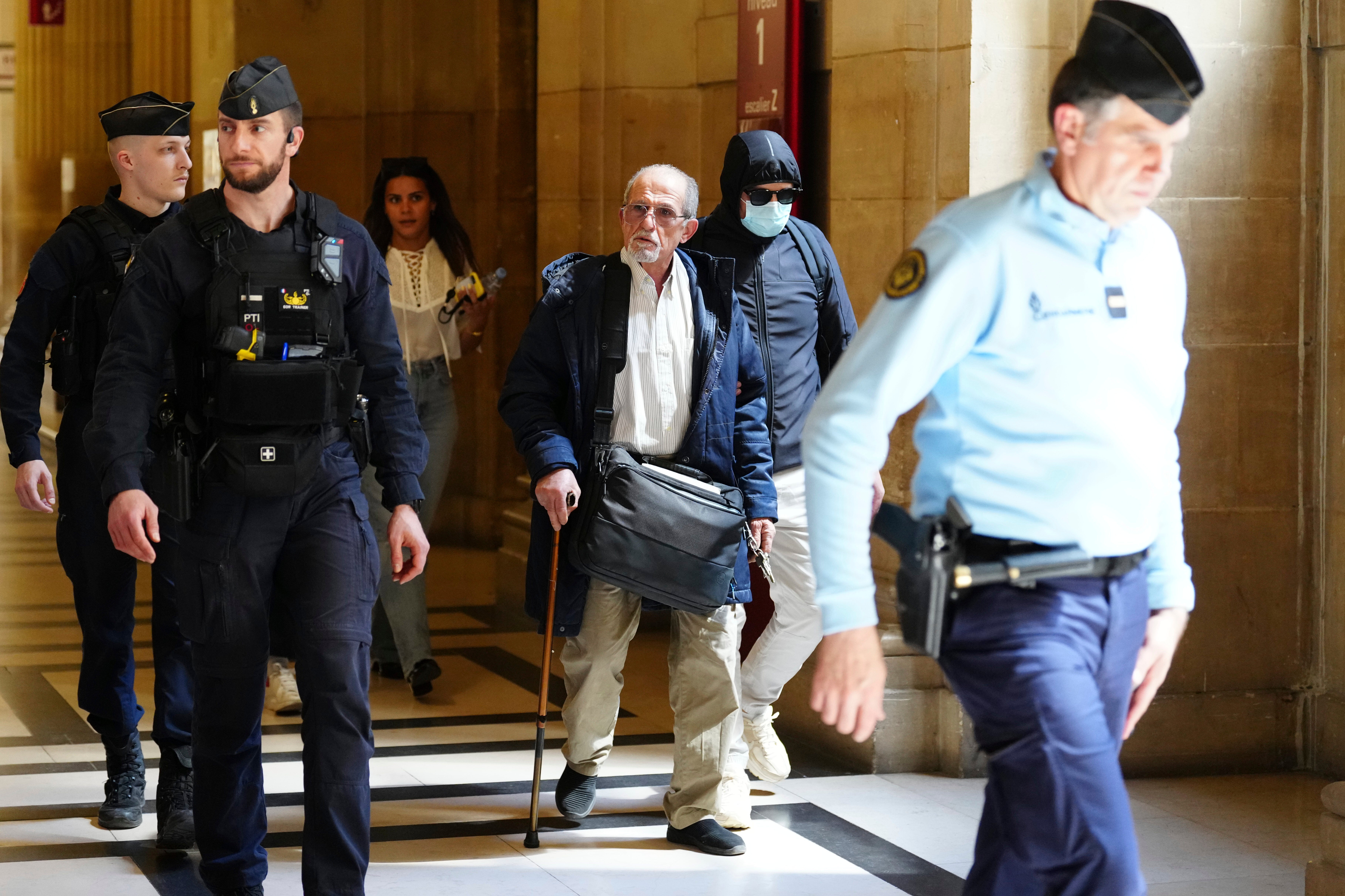 Aomar Ait Khedache walking with a cane in court