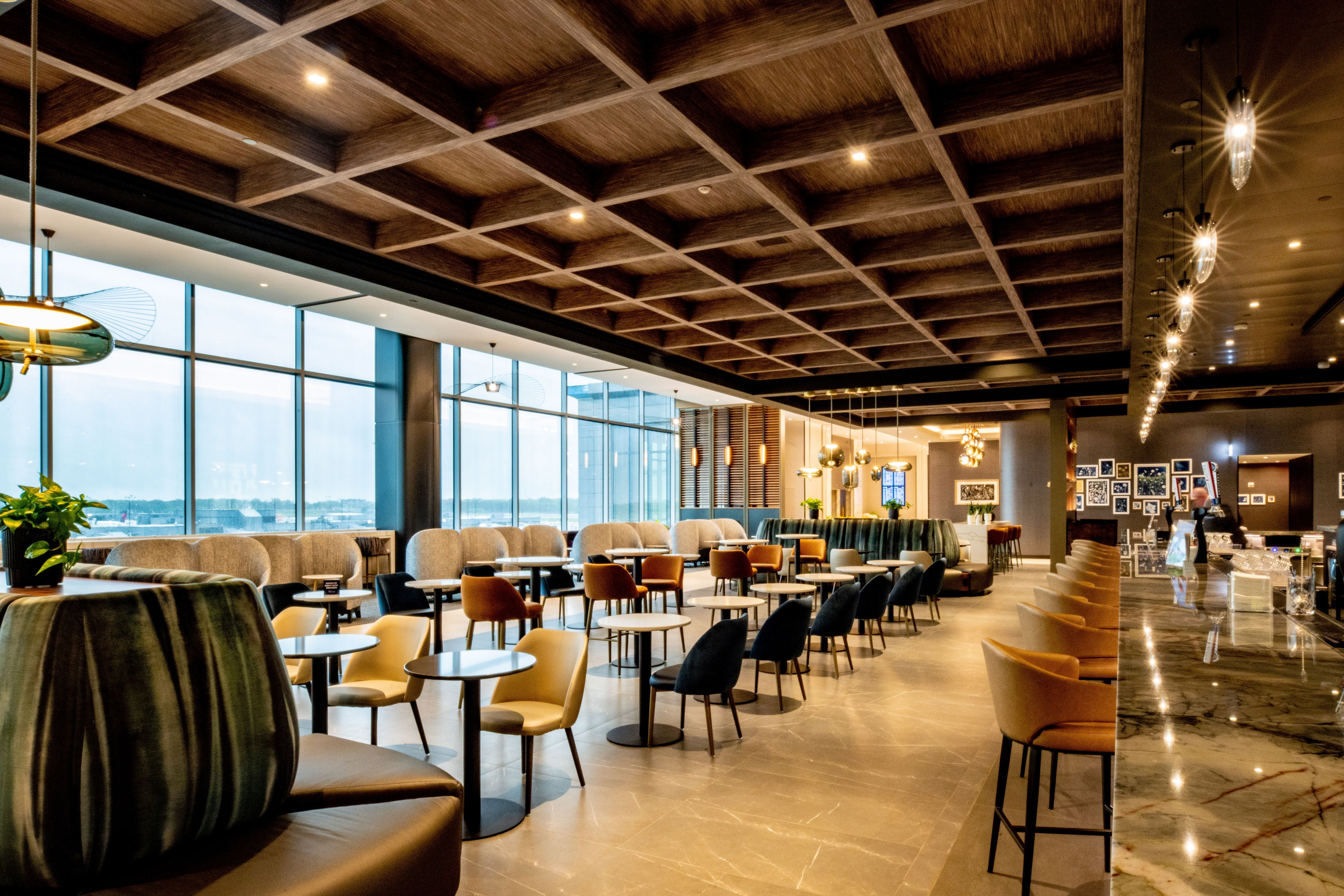 The new lounge is home to a 16-seat bar and boasts panoramic airfield views