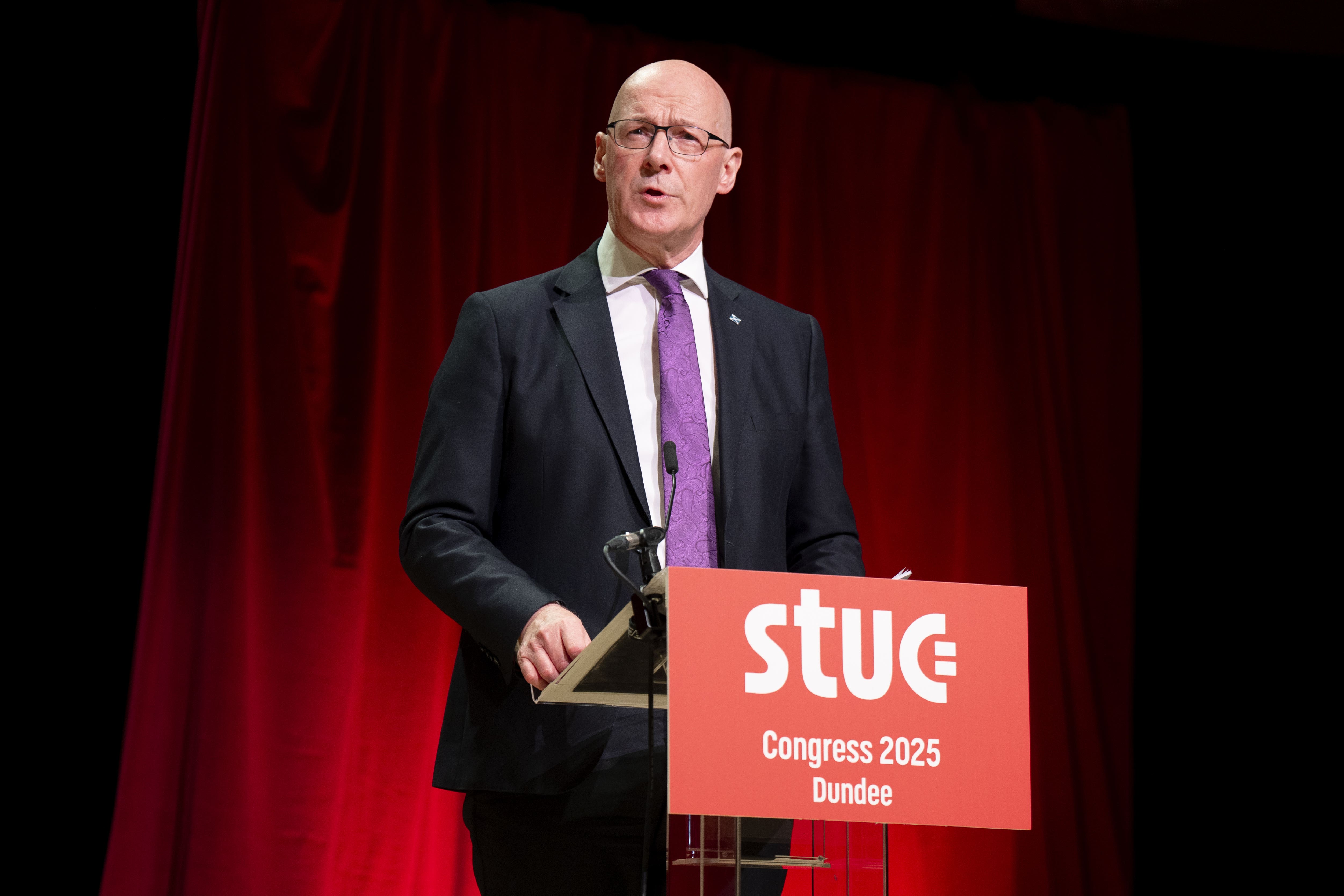 First Minister John Swinney addresses the Scottish Trades Union Congress conference in Dundee (Jane Barlow/PA)