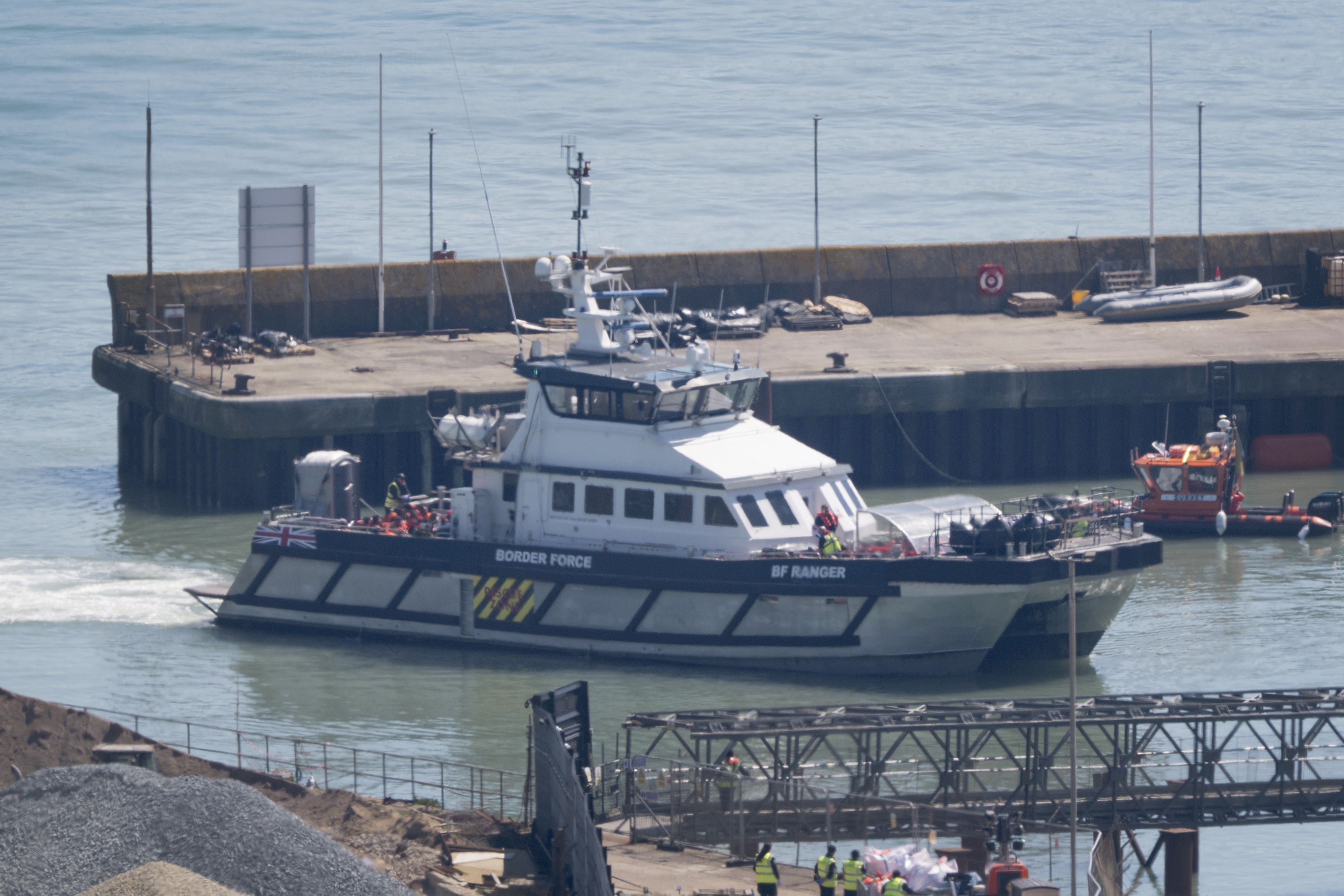 A group of people thought to be migrants are brought in to Dover (Gareth Fuller/PA)
