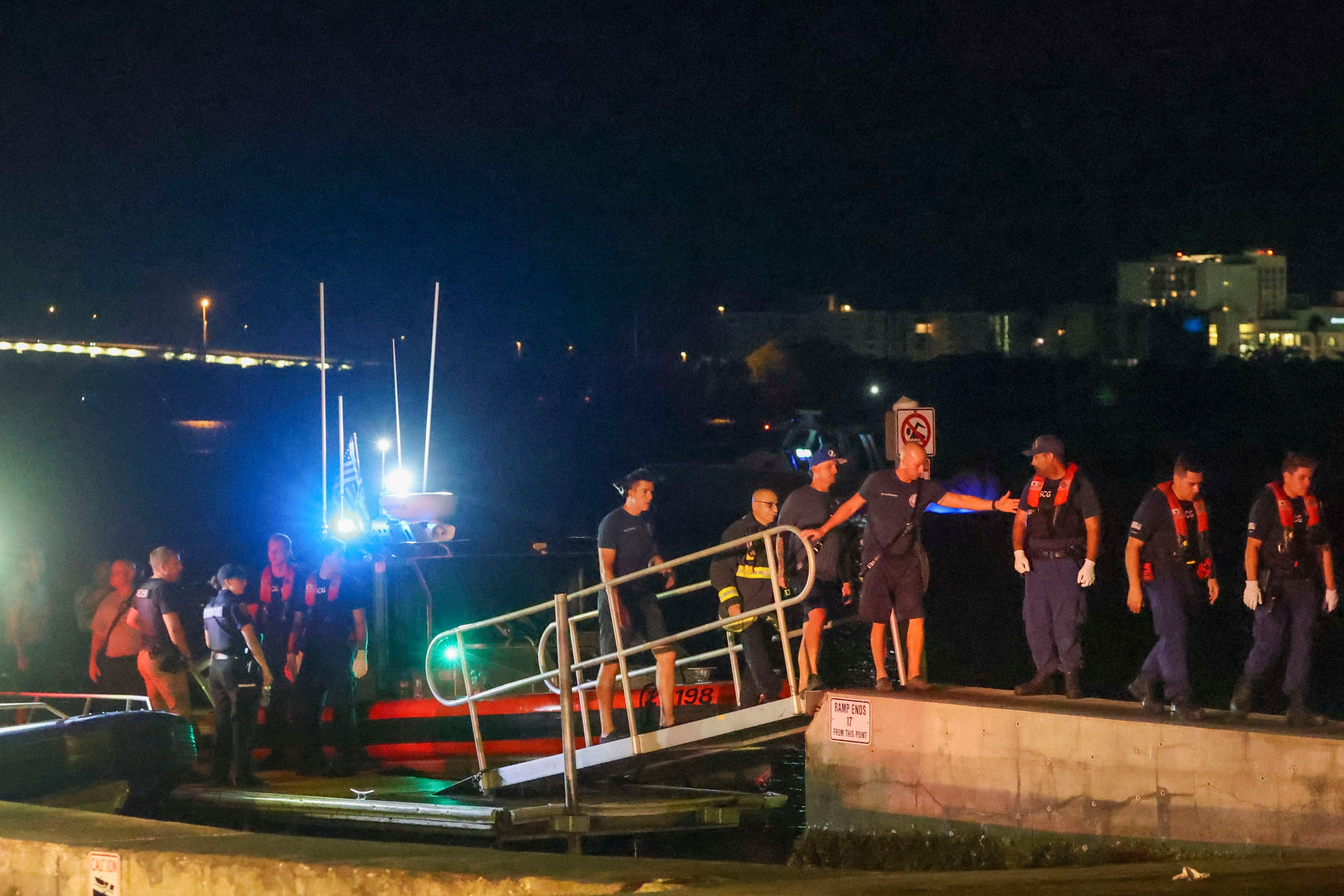 Rescue workers gathered at the Seminole Boat ramp north of where a boat crashed into the ferry, causing multiple injuries near the Clearwater Memorial Causeway Bridge