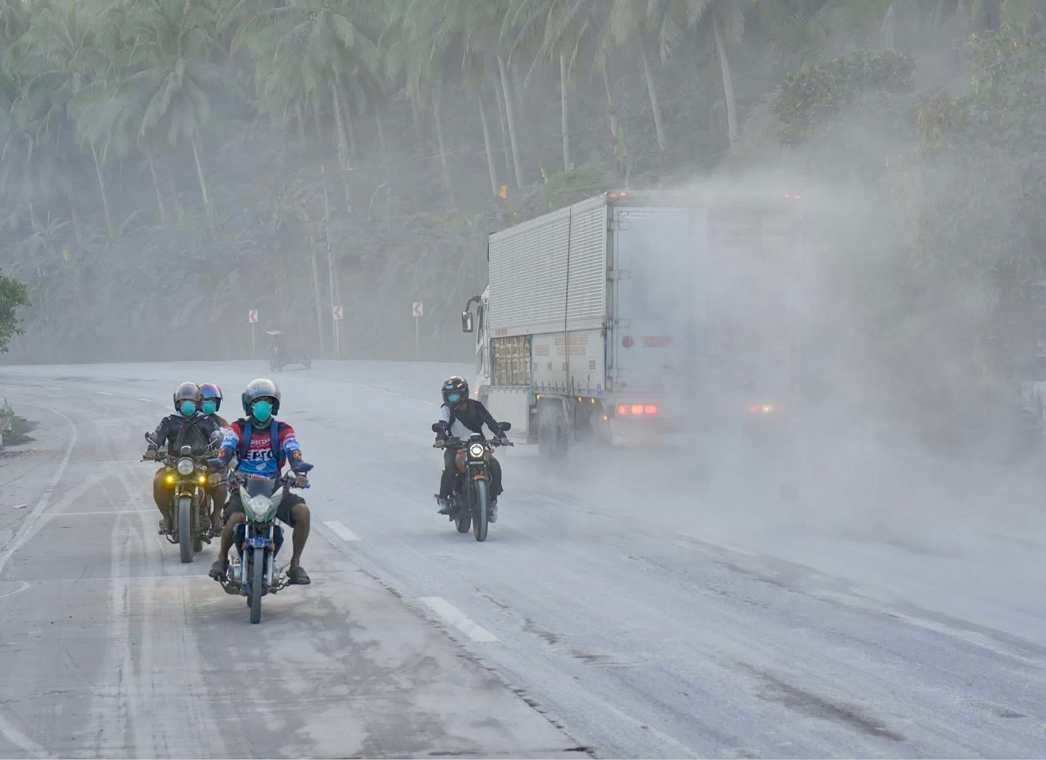 A handout photo made available by the Sorsogon Provincial Information Office (SPIO) shows motorists maneuvering along a road covered with volcanic ash from the Bulusan volcano, in the town of Juban, Sorsogon province, Philippines, 28 April 2025. The Bulusan Volcano in Sorsogon province, about 570 kilometres south of Manila, erupted on 28 April, according to the Philippine Institute of Volcanology and Seismology (Phivolcs), and its plumes reached 4,500 meters high