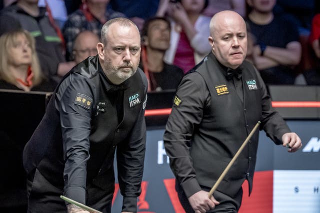 John Higgins (right) established an early lead over Mark Williams (left) (Danny Lawson/PA)