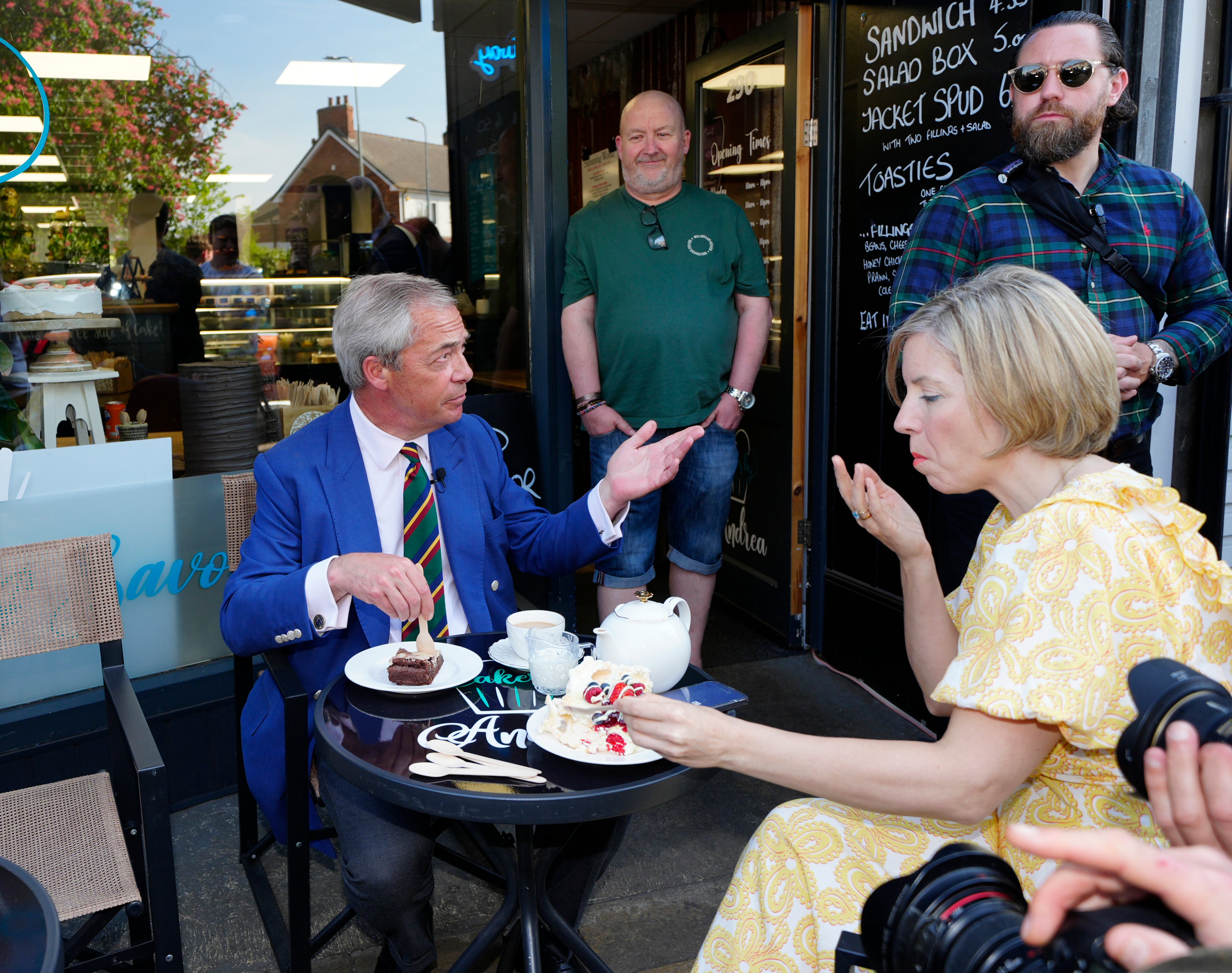 Reform UK party leader Nigel Farage and Greater Lincolnshire mayoral candidate Dame Andrea Jenkyns pause for afternoon tea and cake whilst campaigning in Scunthorpe