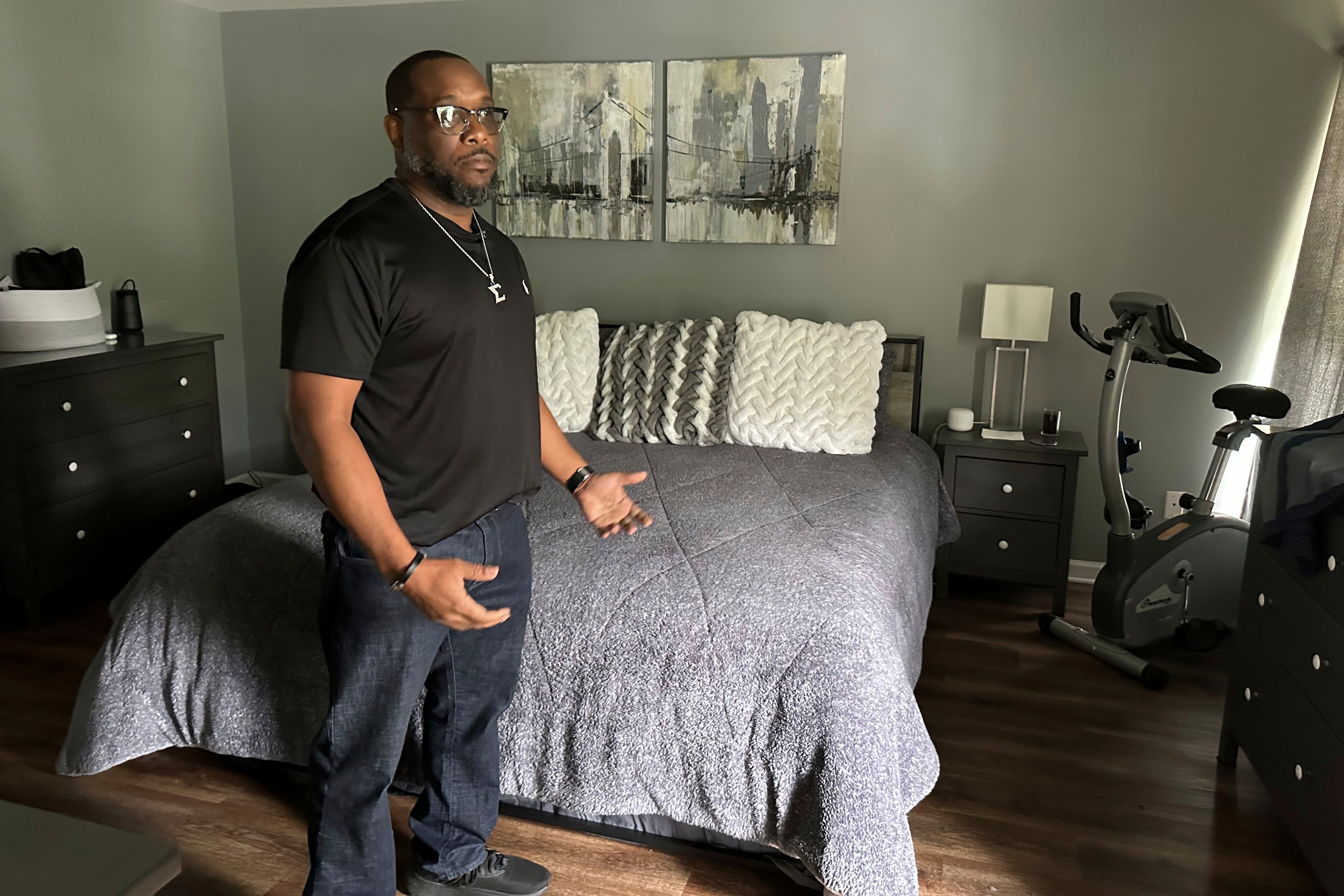 Cliatt stands in the bedroom where he and his former partner Trina Martin were sleeping when FBI agents suddenly raided their home