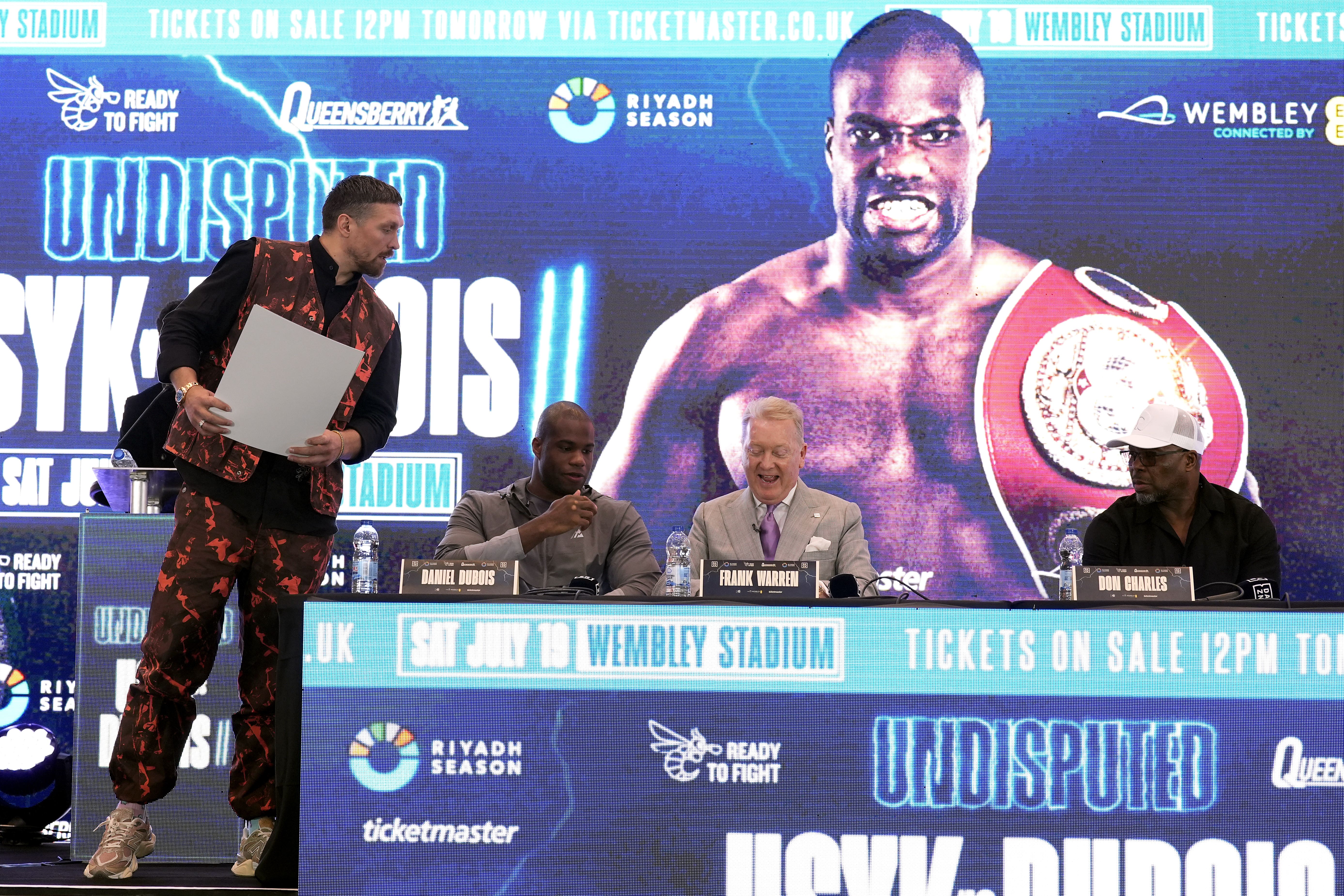 Oleksandr Usyk’s (left) faith was brought into question by Daniel Dubois’ trainer Don Charles (far right) (Andrew Matthews/PA)