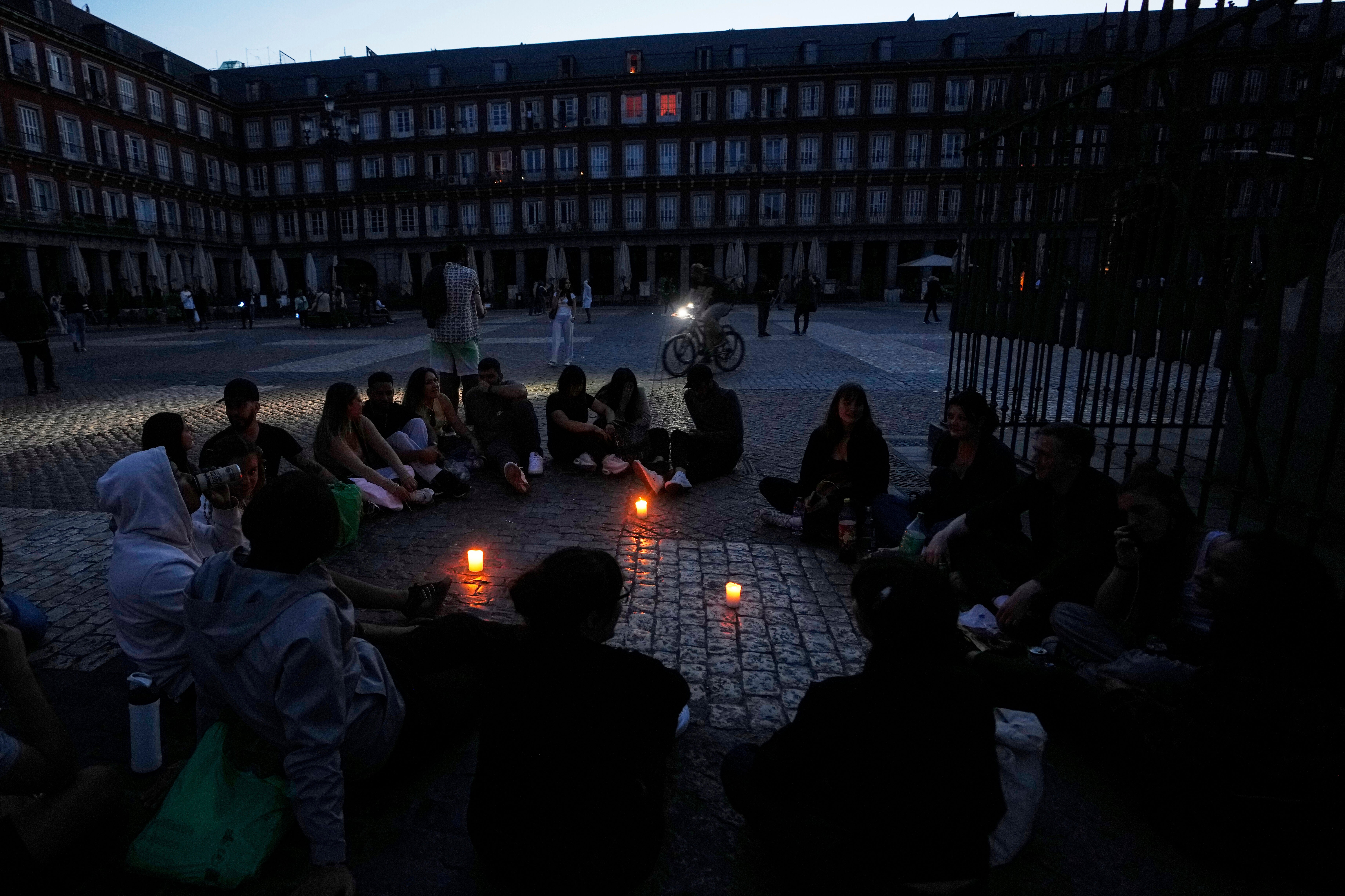 People gather in Plaza Mayor, downtown Madrid, during a major power outage, Monday