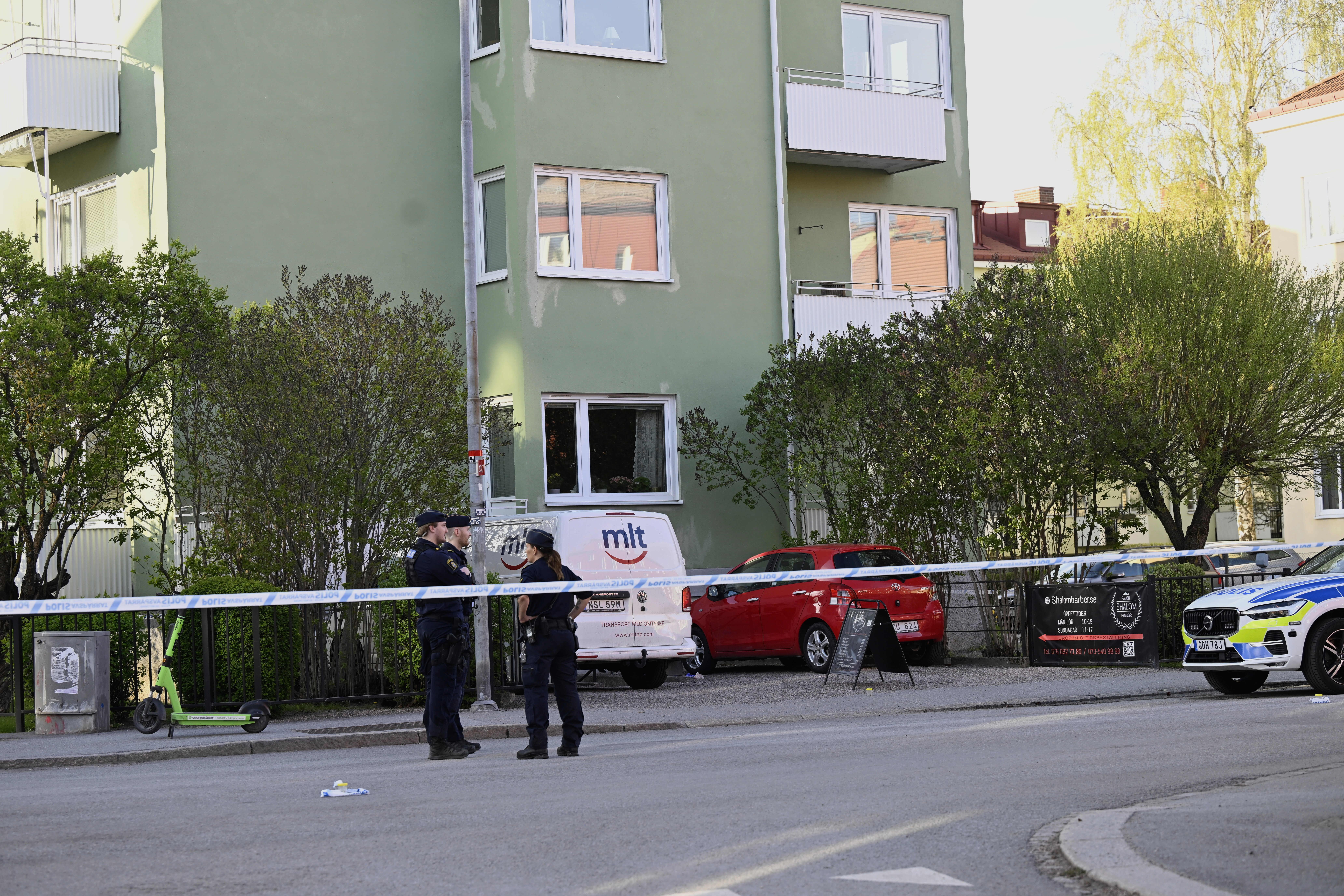 Police at the scene after a shooting incident at Vaksala Square in central Uppsala on Tuesday