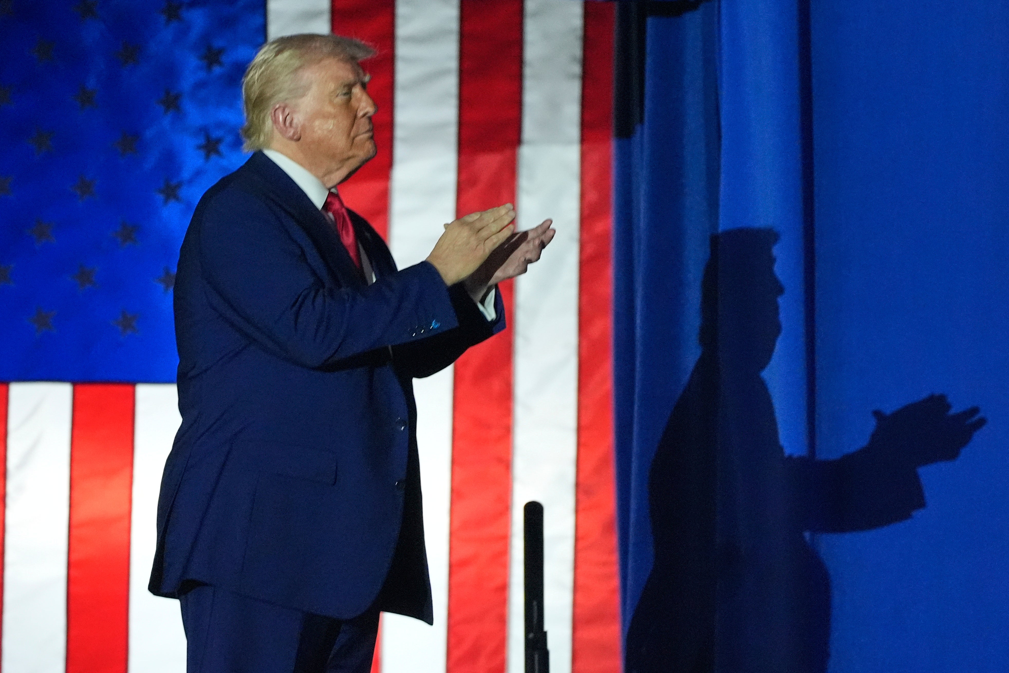 Donald Trump arrives to speak on his first 100 days at Macomb County Community College Sports Expo Center in Warren, Michigan Tuesday (AP Photo/Alex Brandon)