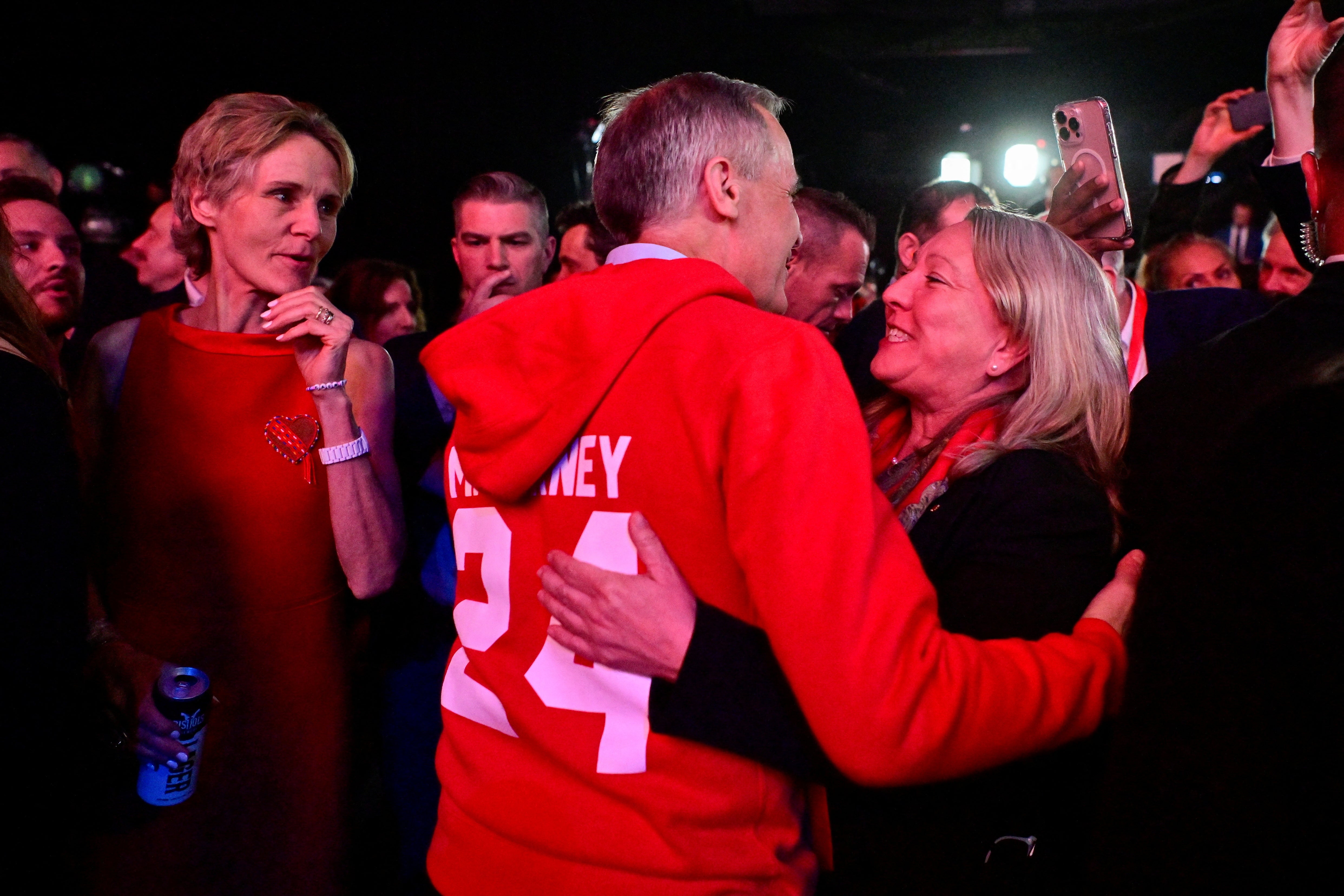 Canada's prime minister Mark Carney greets a supporter as his wife Diana Fox Carney looks on, during an event at the Liberal Party election night headquarters in Ottawa, Ontario, Canada 29 April 2025