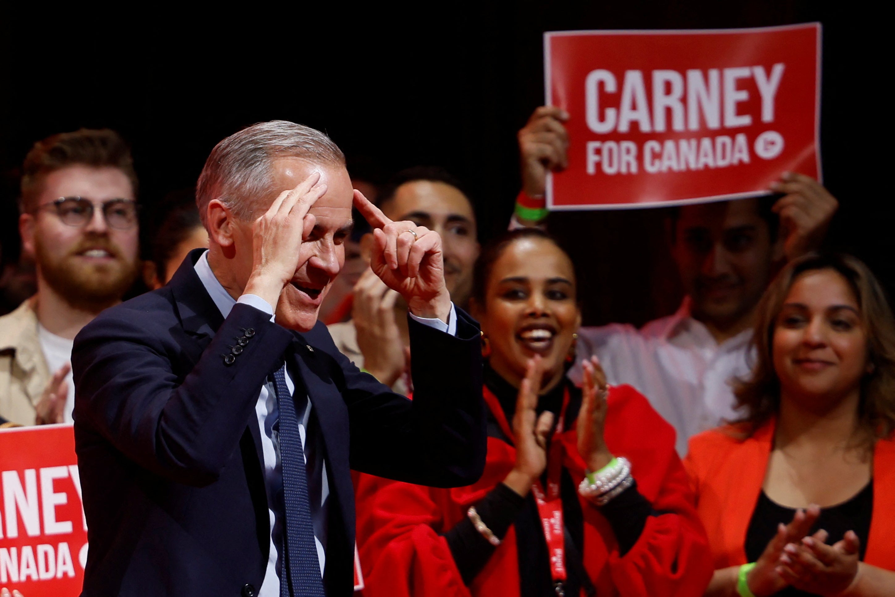 Canada's prime minister Mark Carney gestures after his win