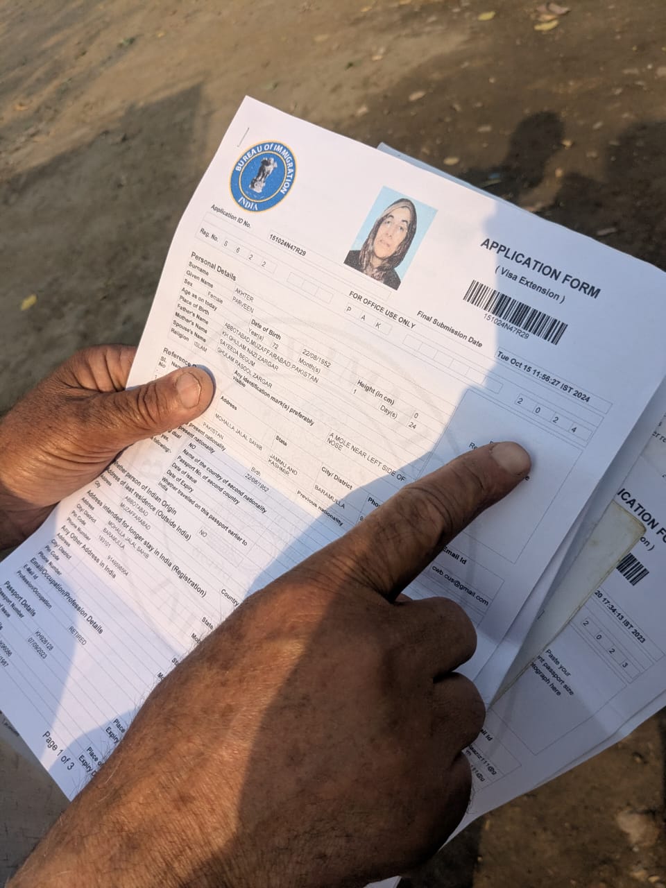 Ghulam Masoor shows his spouse’s visa documents that are valid until September 2026