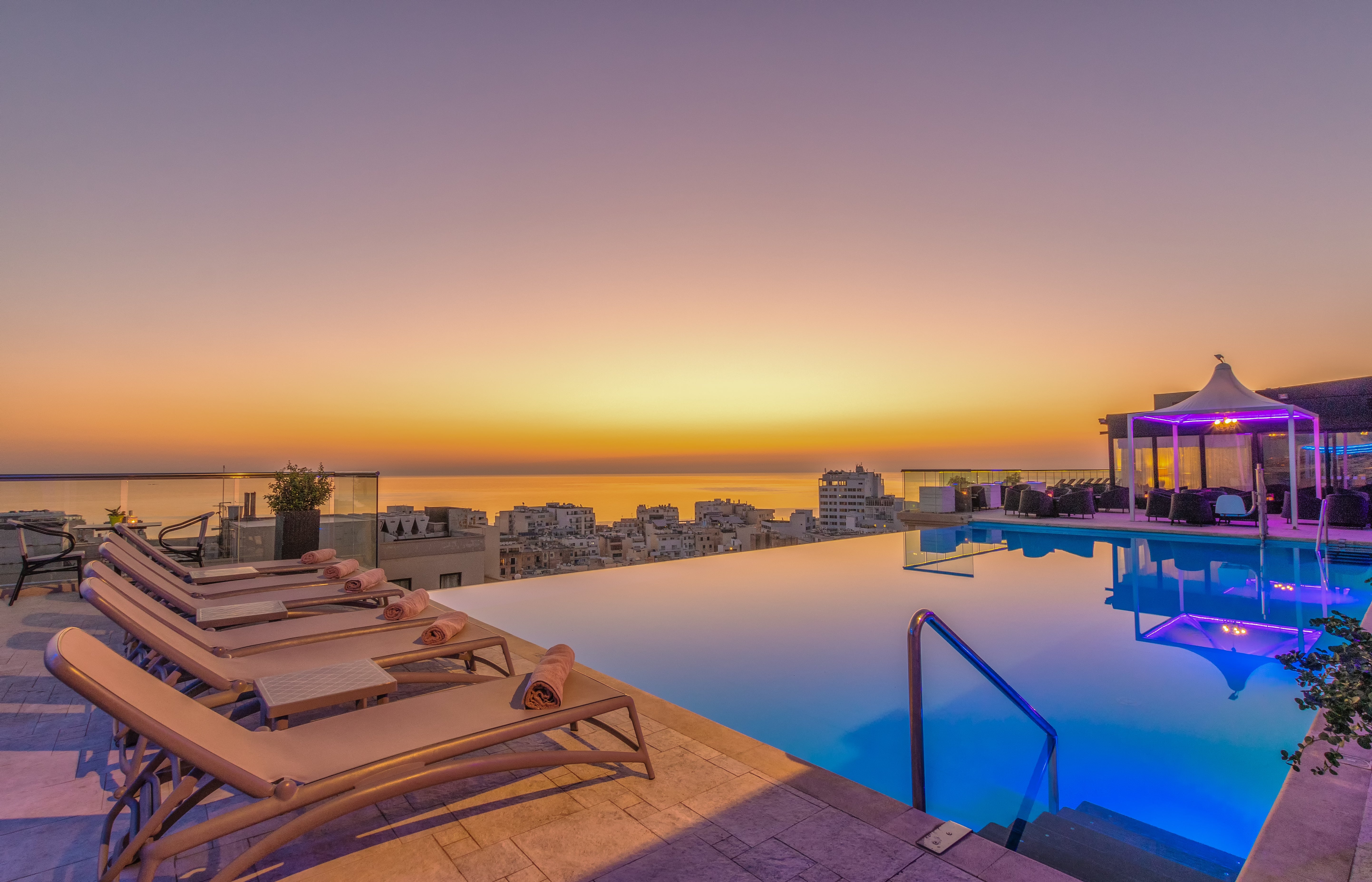 The Palace’s heated outdoor rooftop pool is the perfect place to watch the sunset