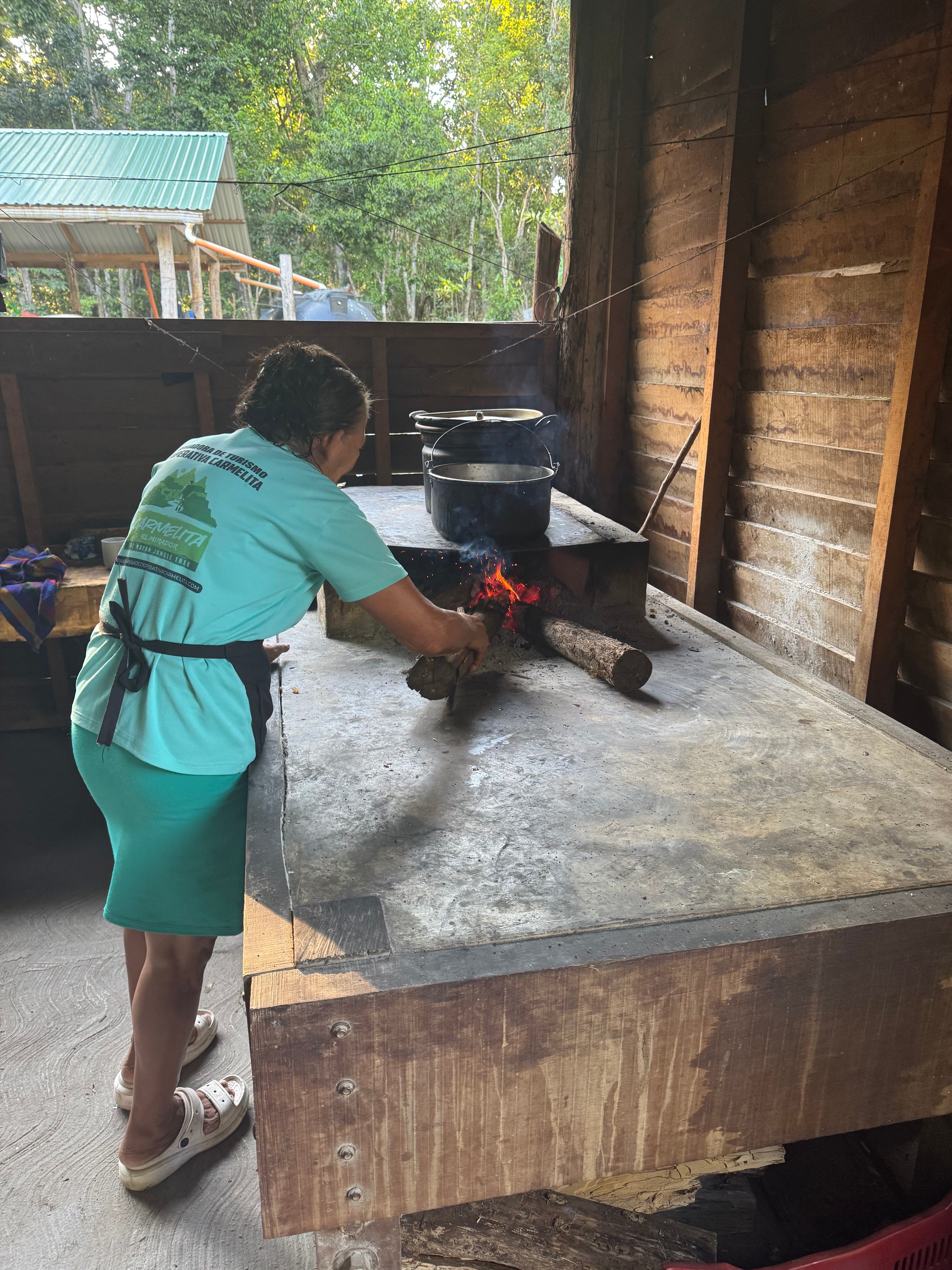 Maria prepares dinner at base camp