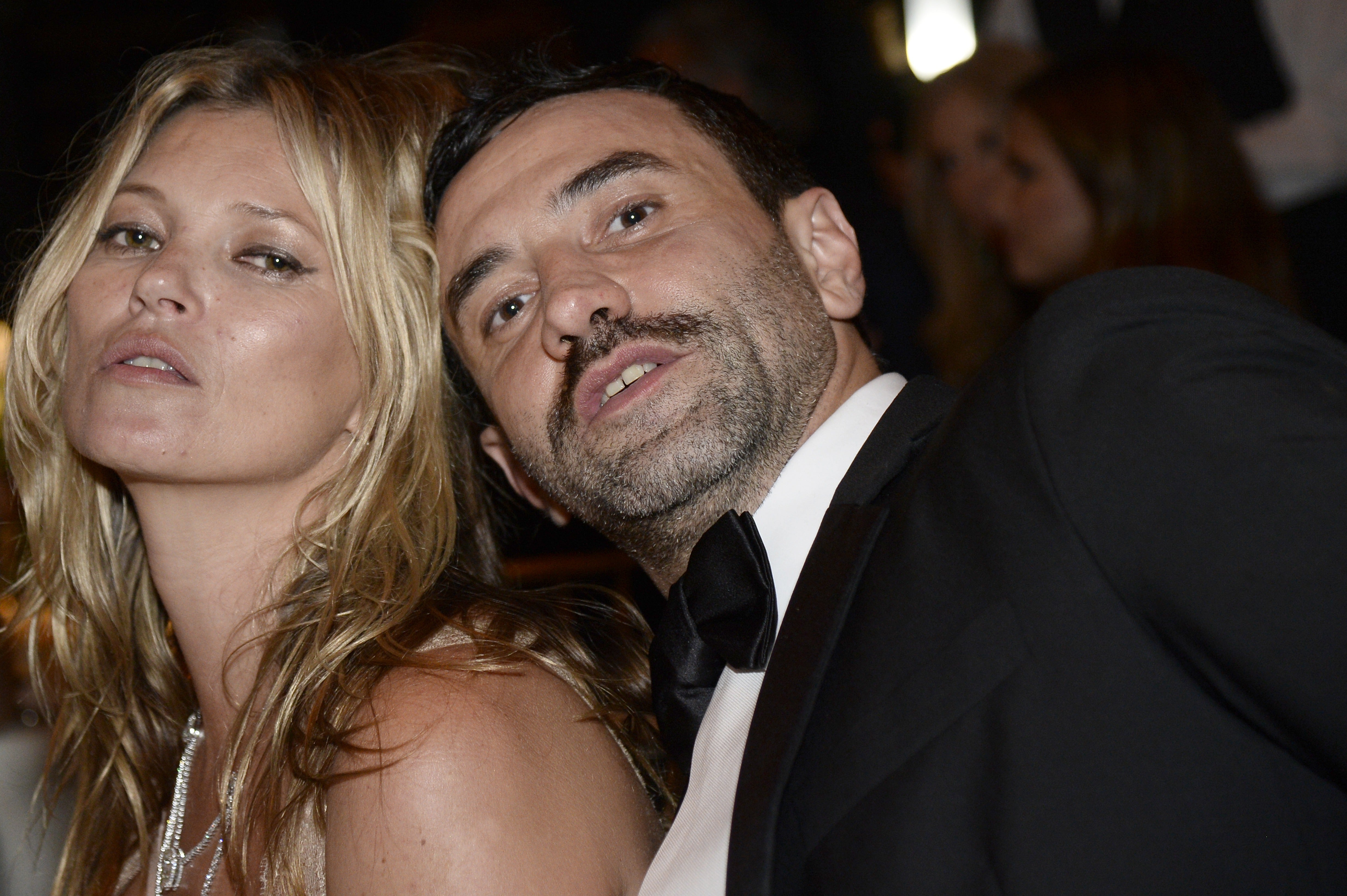 Tisci, seen here with supermodel Kate Moss, is one of the fashion world's biggest names.