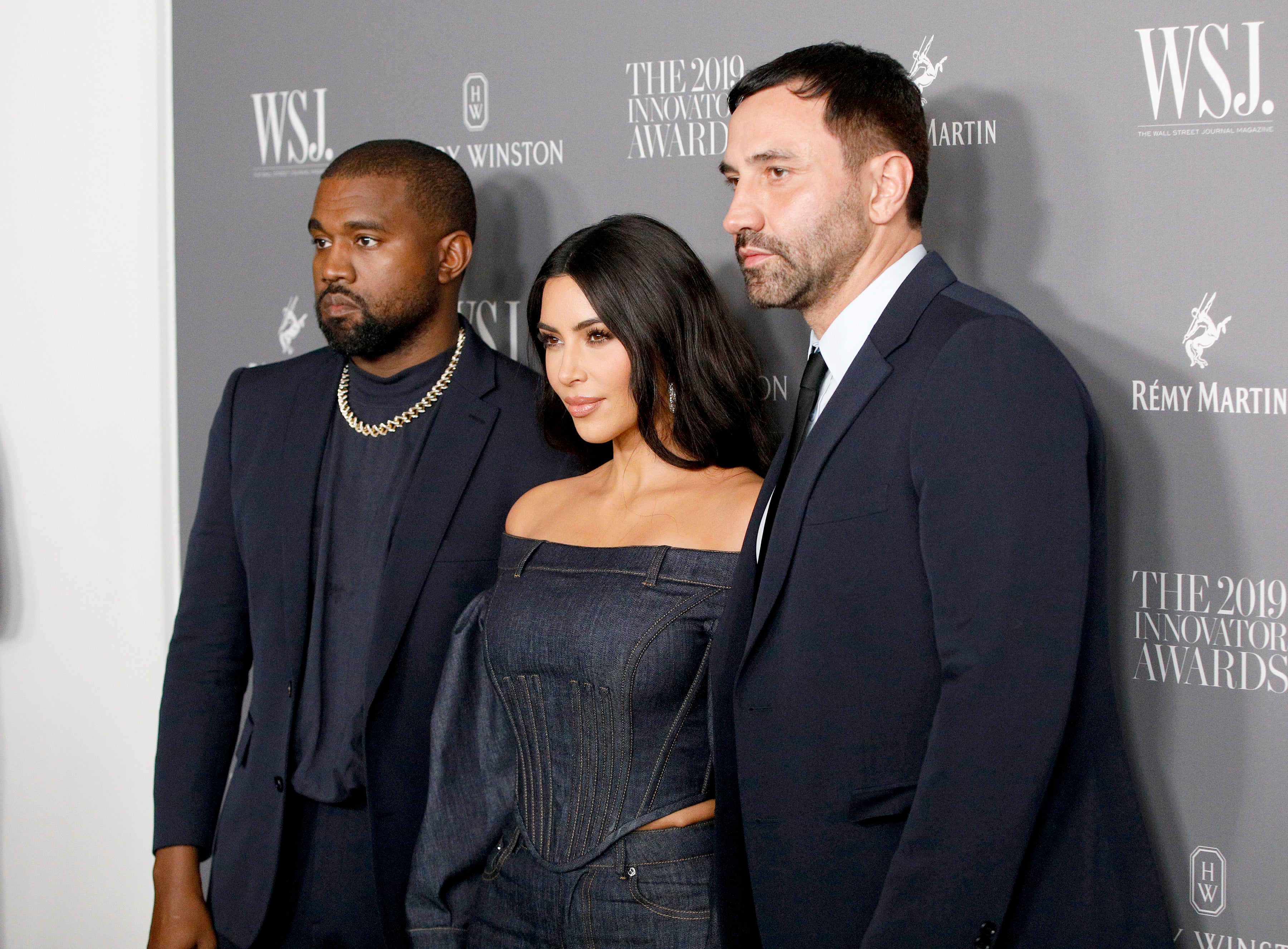 Tisci (right) dressed Kim Kardashian for her 2014 wedding to rapper Kanye West