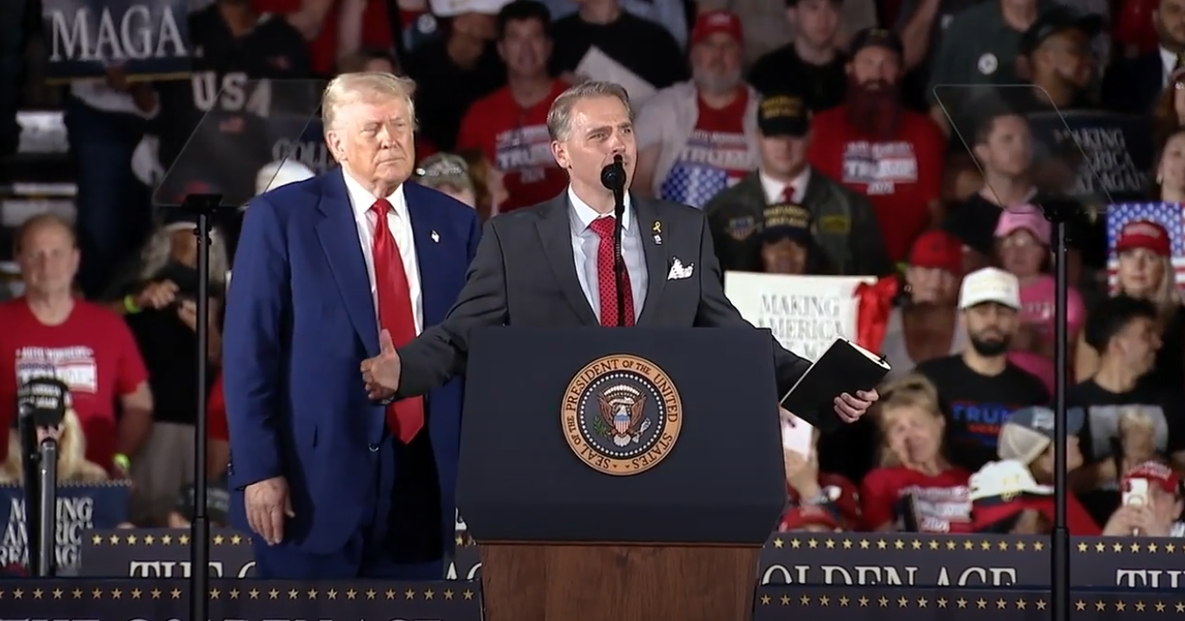 CNN senior political commentator Scott Jennings appears onstage at Donald Trump's first 100 days rally in Michigan. The network says it has no problem with appearance, as Jennings is not a full-time employee.