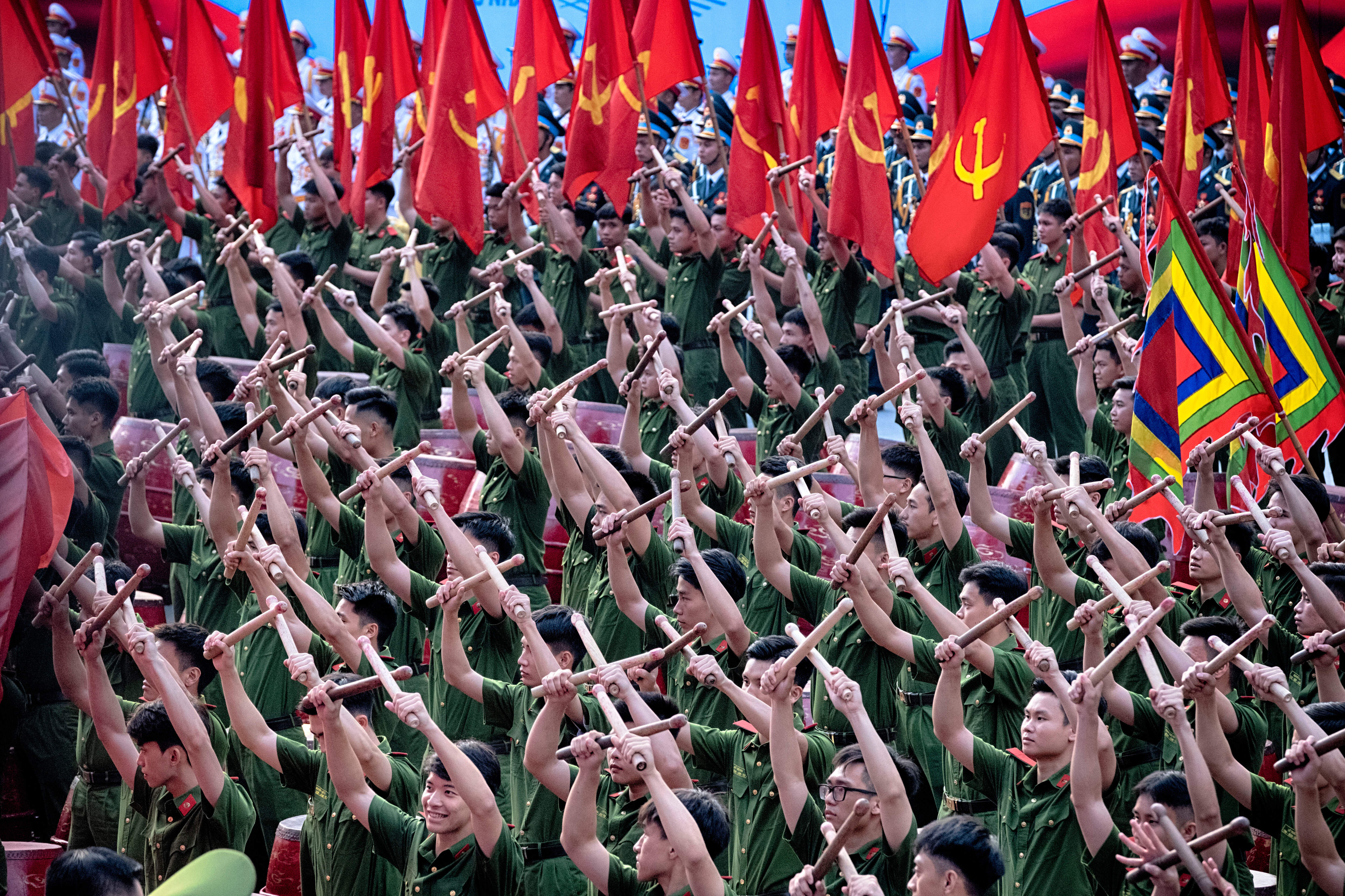 Vietnamese drummers perform during a parade celebrating the 50th anniversary of the end of the Vietnam War
