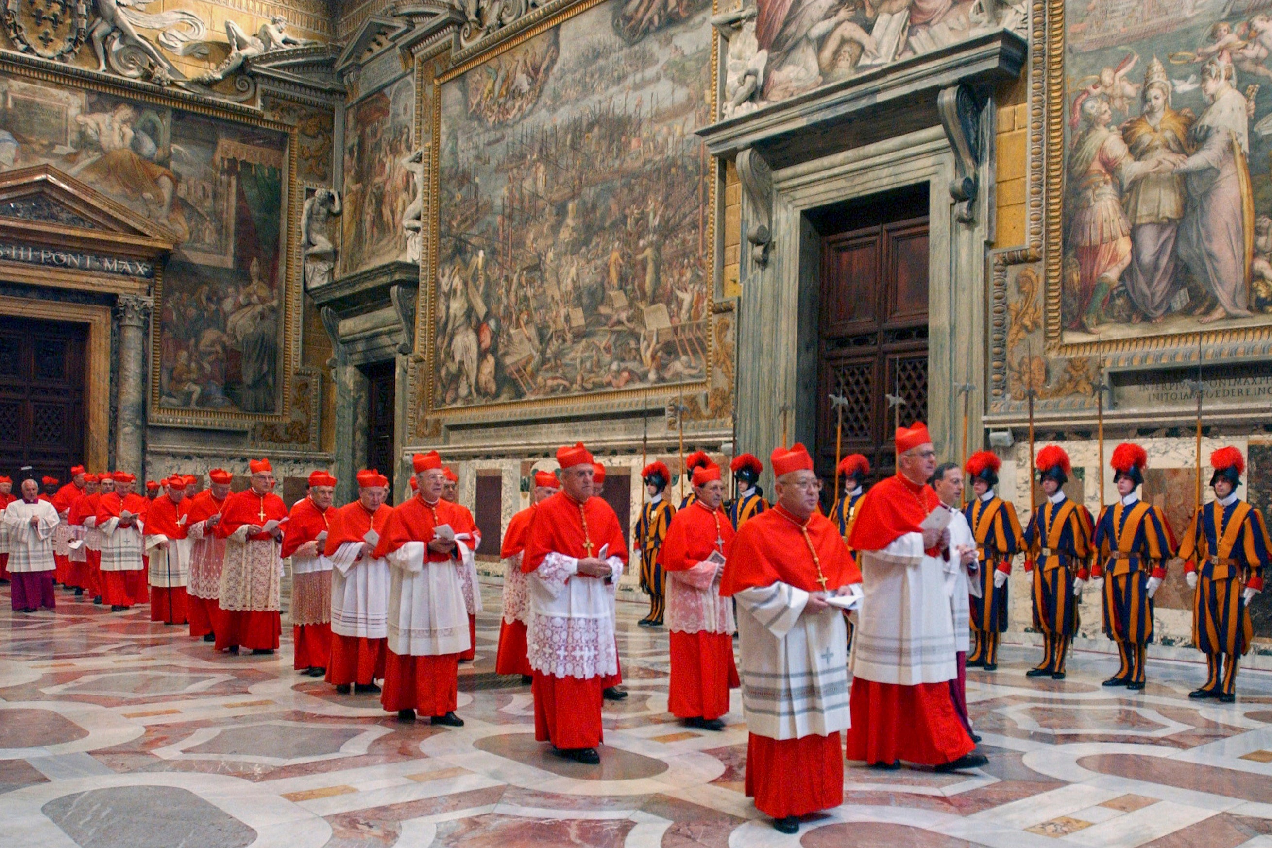 Cardinals file through the Vatican in Rome