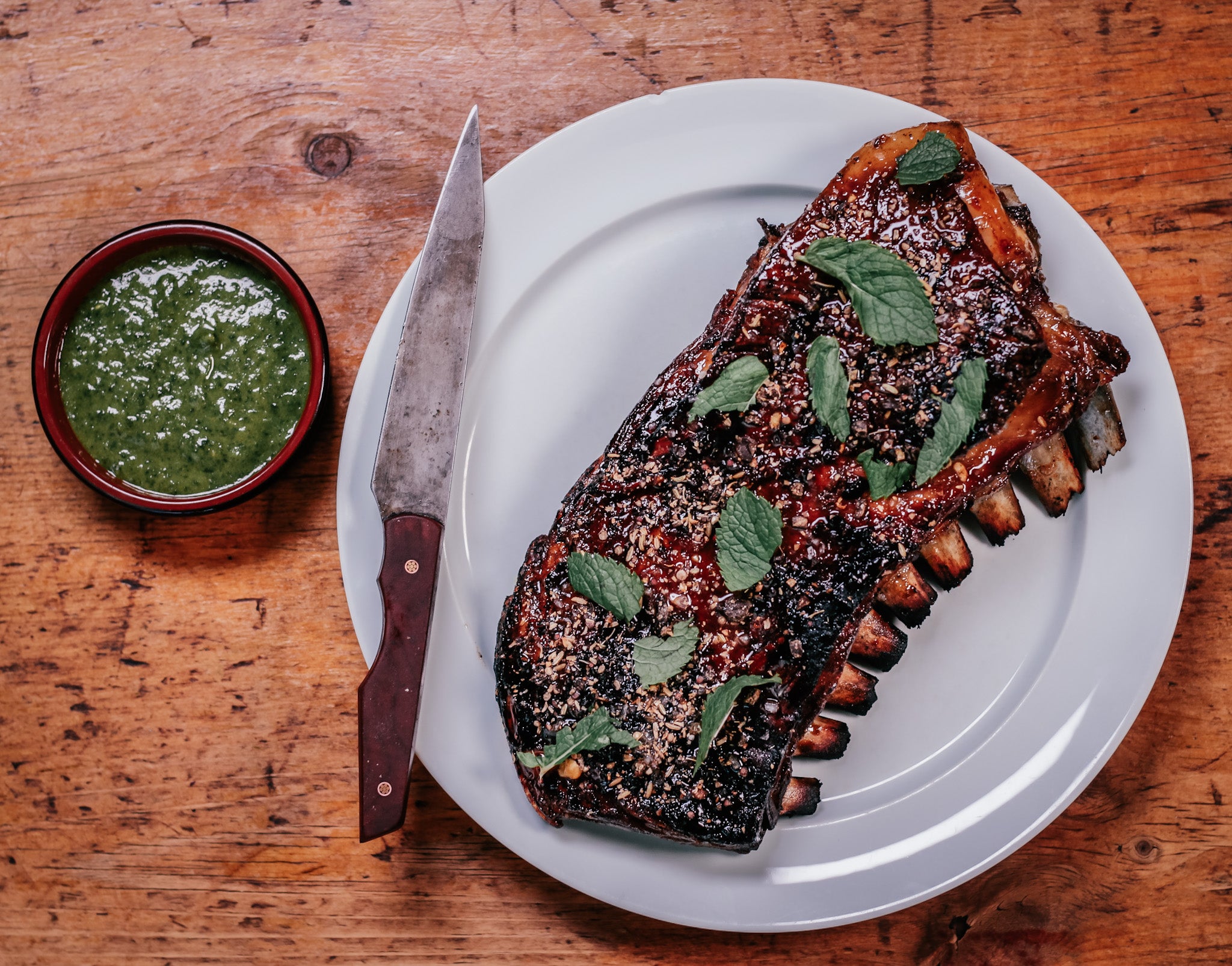 Slow-grilled lamb ribs glazed in honey and date syrup are the kind of showstopper that makes you the designated barbecuer for life