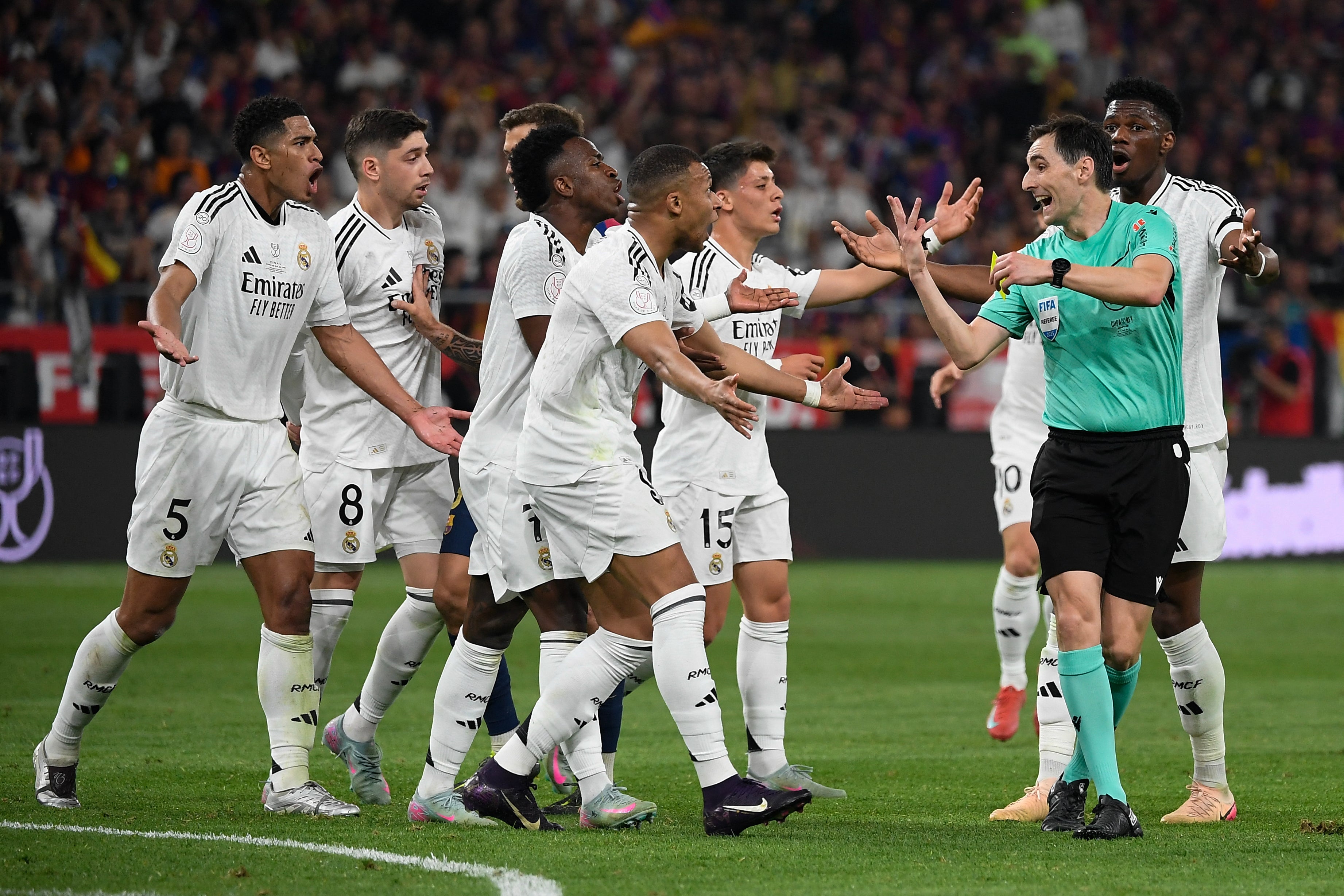 Real Madrid's players remonstrated with the referee as they lost to Barcelona