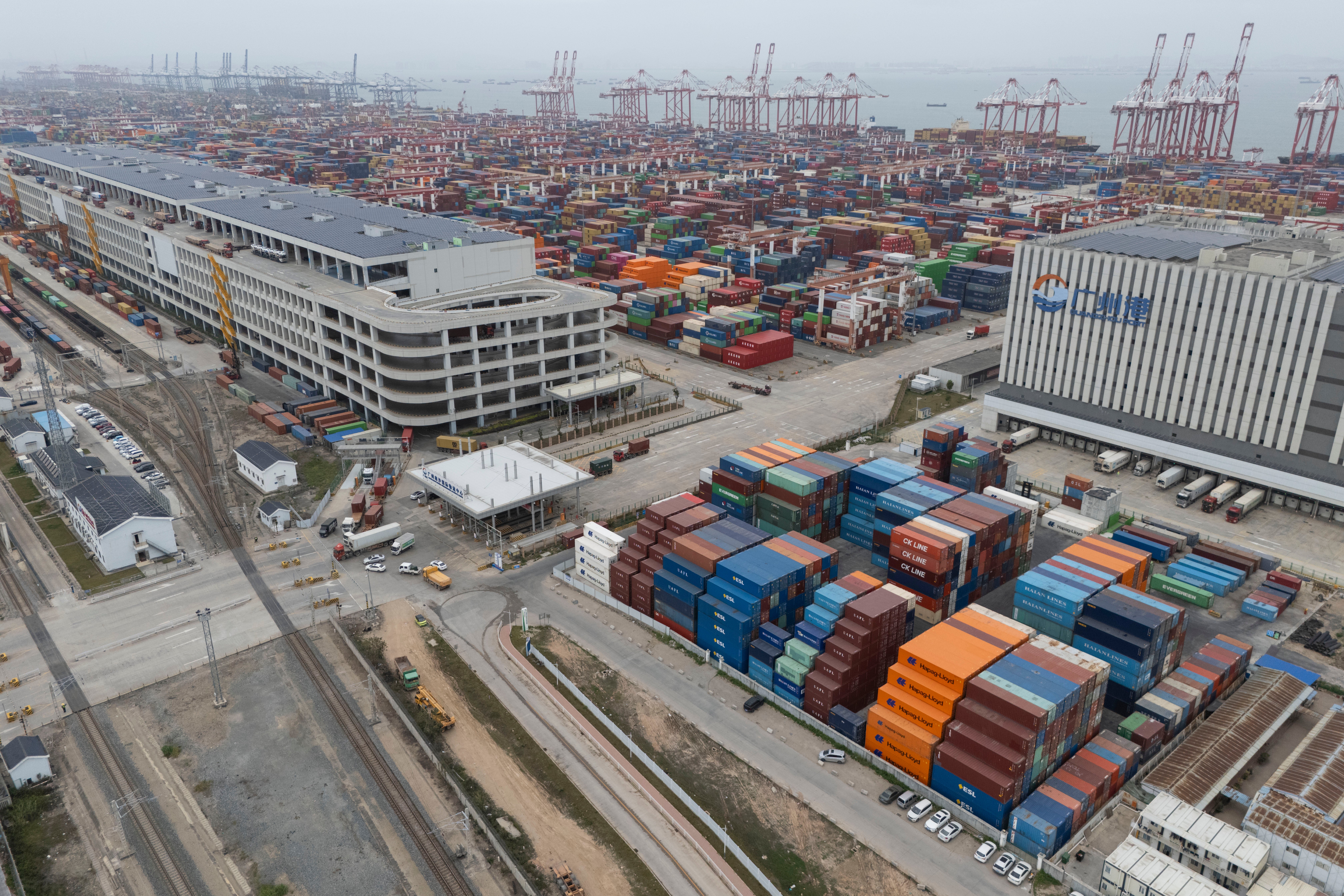File. Shipping containers are seen ready for transport at the Guangzhou port in China on 17 April 2025