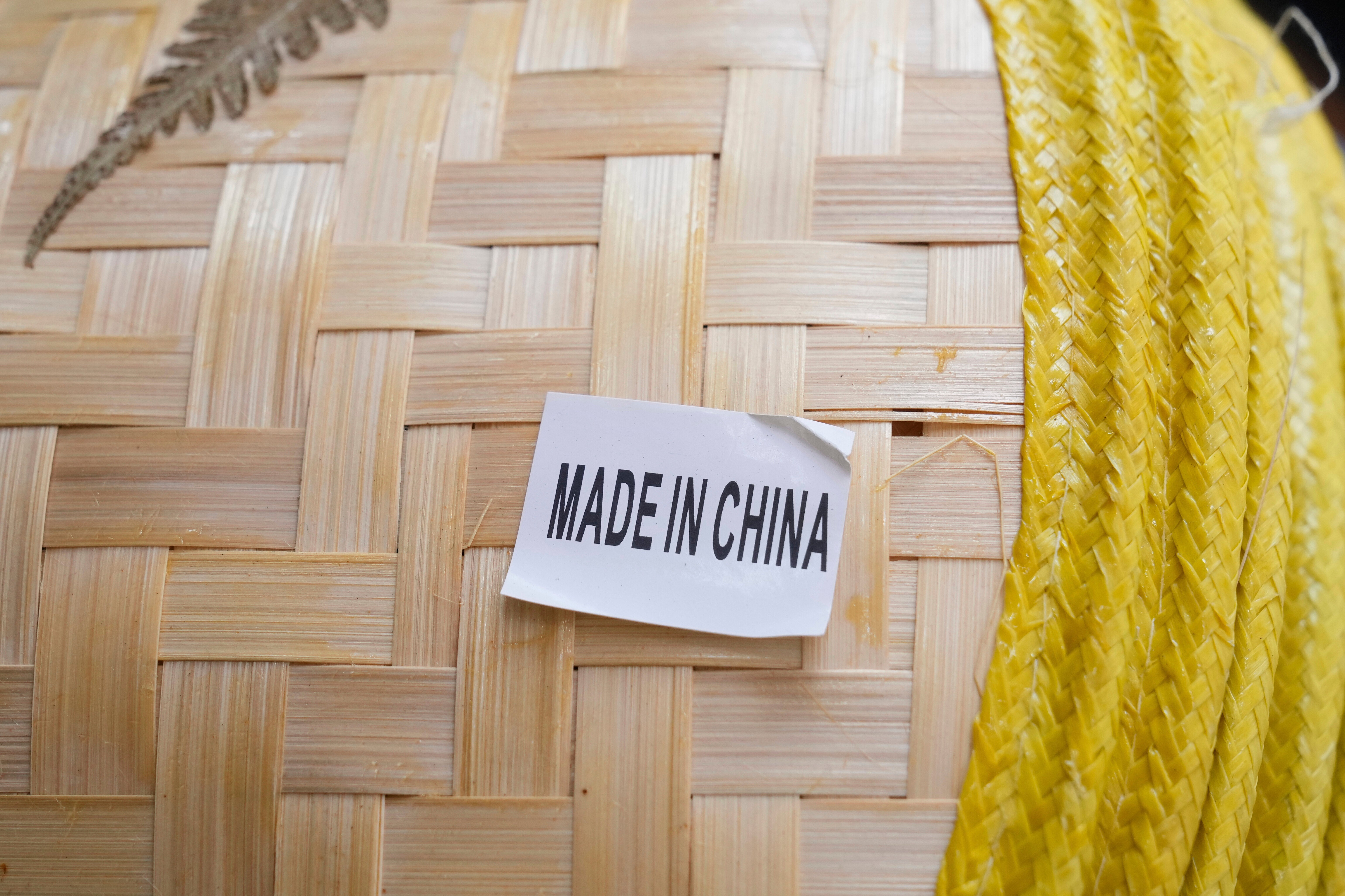 FILE - A made in China sticker is displayed on a hat at a store in Chinatown in San Francisco, April 18, 2025. (AP Photo/Jeff Chiu, File)