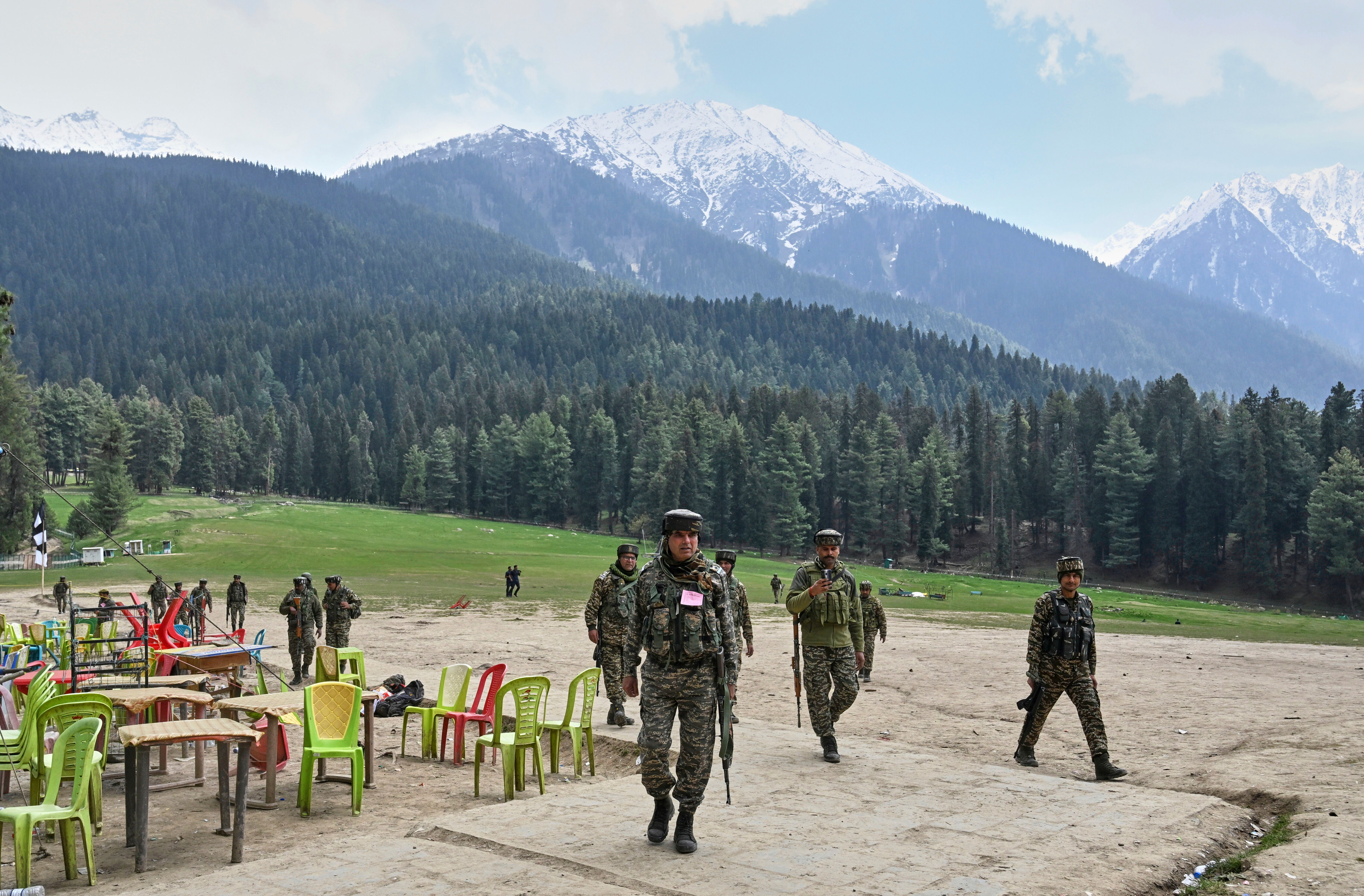Indian security officers inspect the site a day after where militants indiscriminately opened fire at tourists in Pahalgam, Indian administered Kashmir, Wednesday, April 23, 2025
