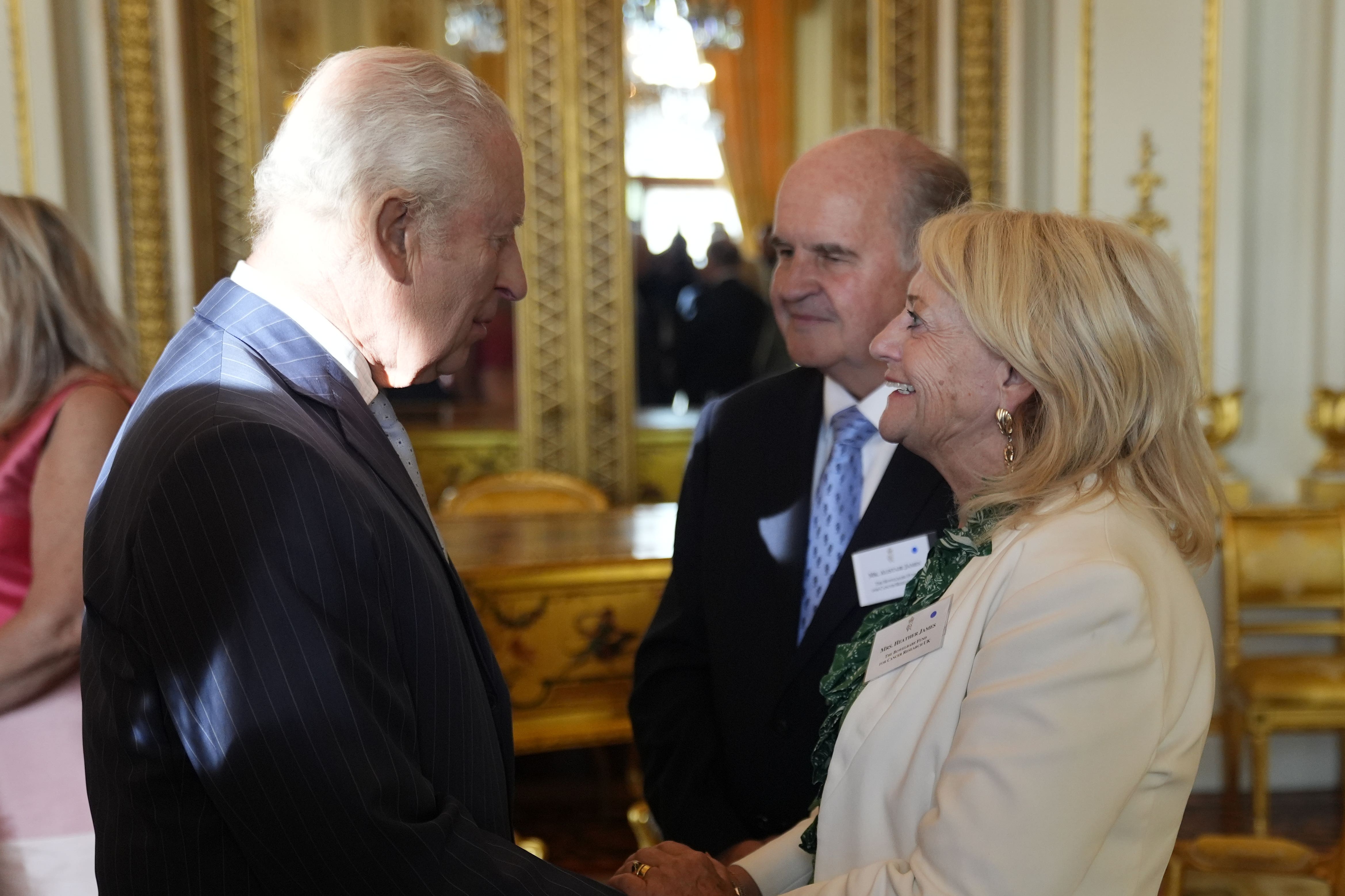 The King met Alistair and Heather James, the parents of the late Dame Deborah James, during a reception in Buckingham Palace (Andrew Matthews/PA)