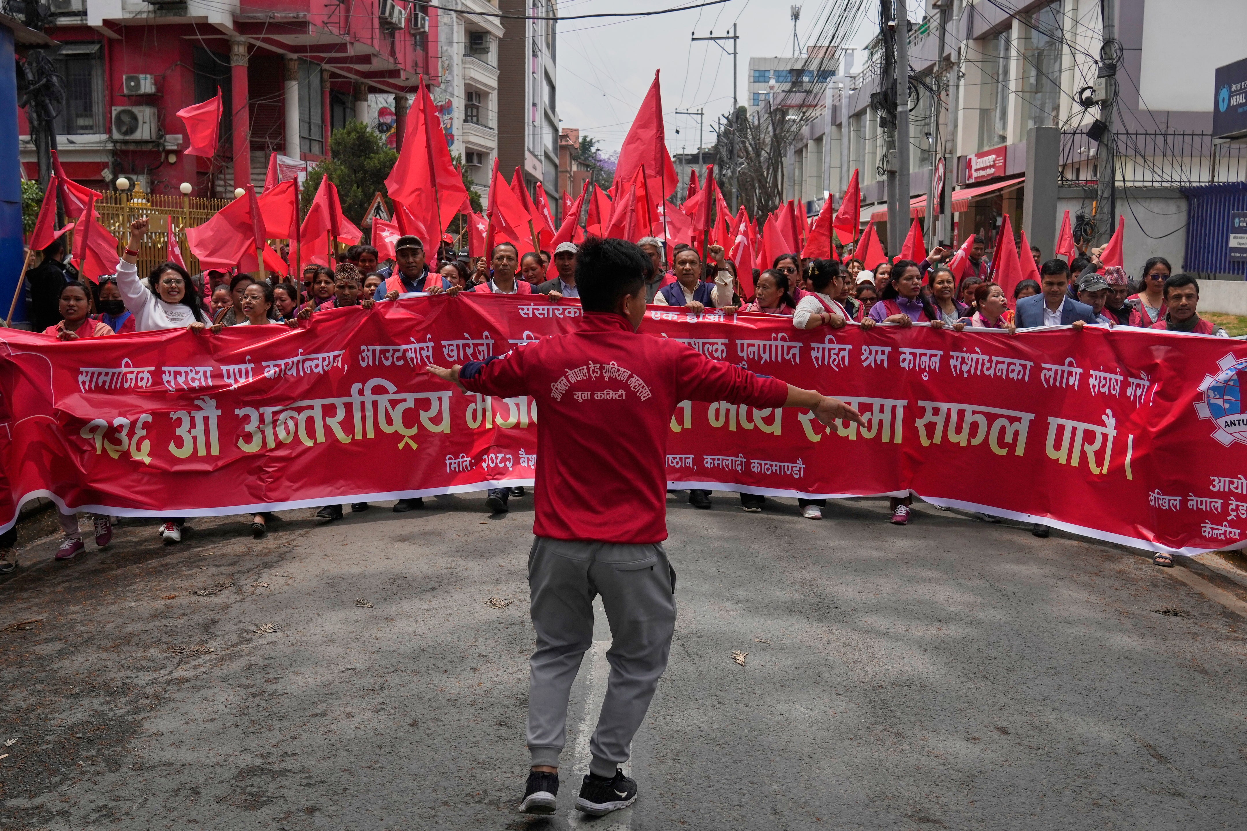 Workers affiliated with Communist Party of Nepal (Maoist Centre) participate in a May Day rally in Kathmandu, Nepal, Thursday, May 1, 2025. (AP Photo/Niranjan Shrestha)