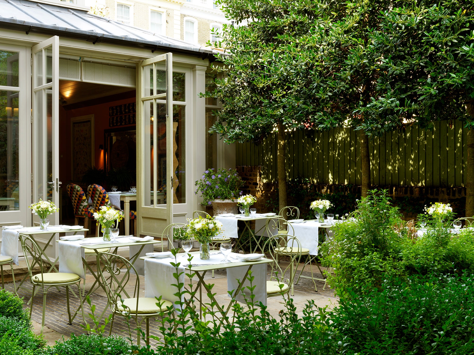 Pull up a sage-coloured table to enjoy a cappuccino in Number Sixteen’s whimsical garden