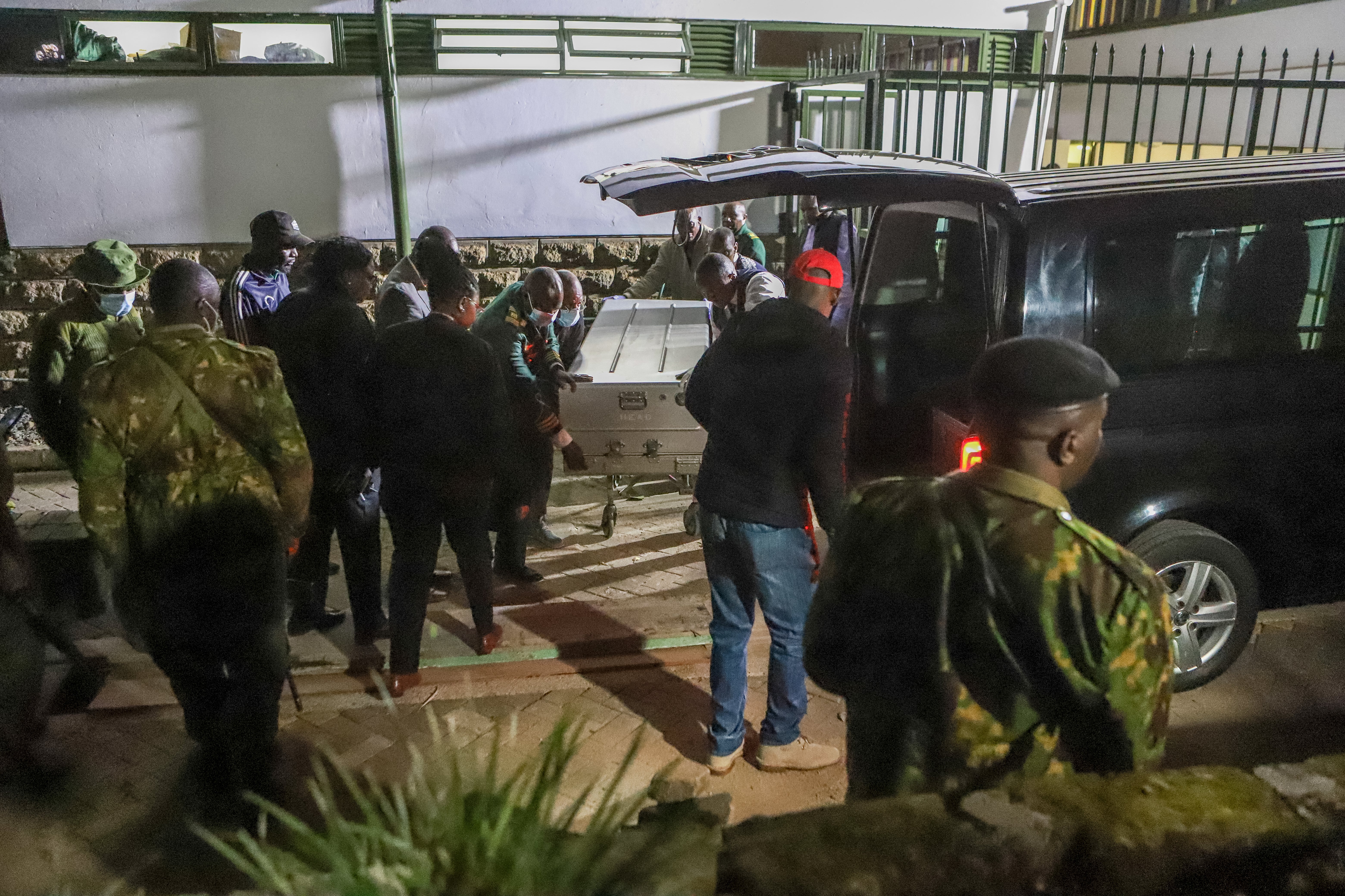 Police officers and hospital staff carry the casket with body of Kasipul member of parliament Charles Ong'ondo Were at the Nairobi Hospital after he was shot dead by unknown gunmen riding on a motorcycle in Nairobi