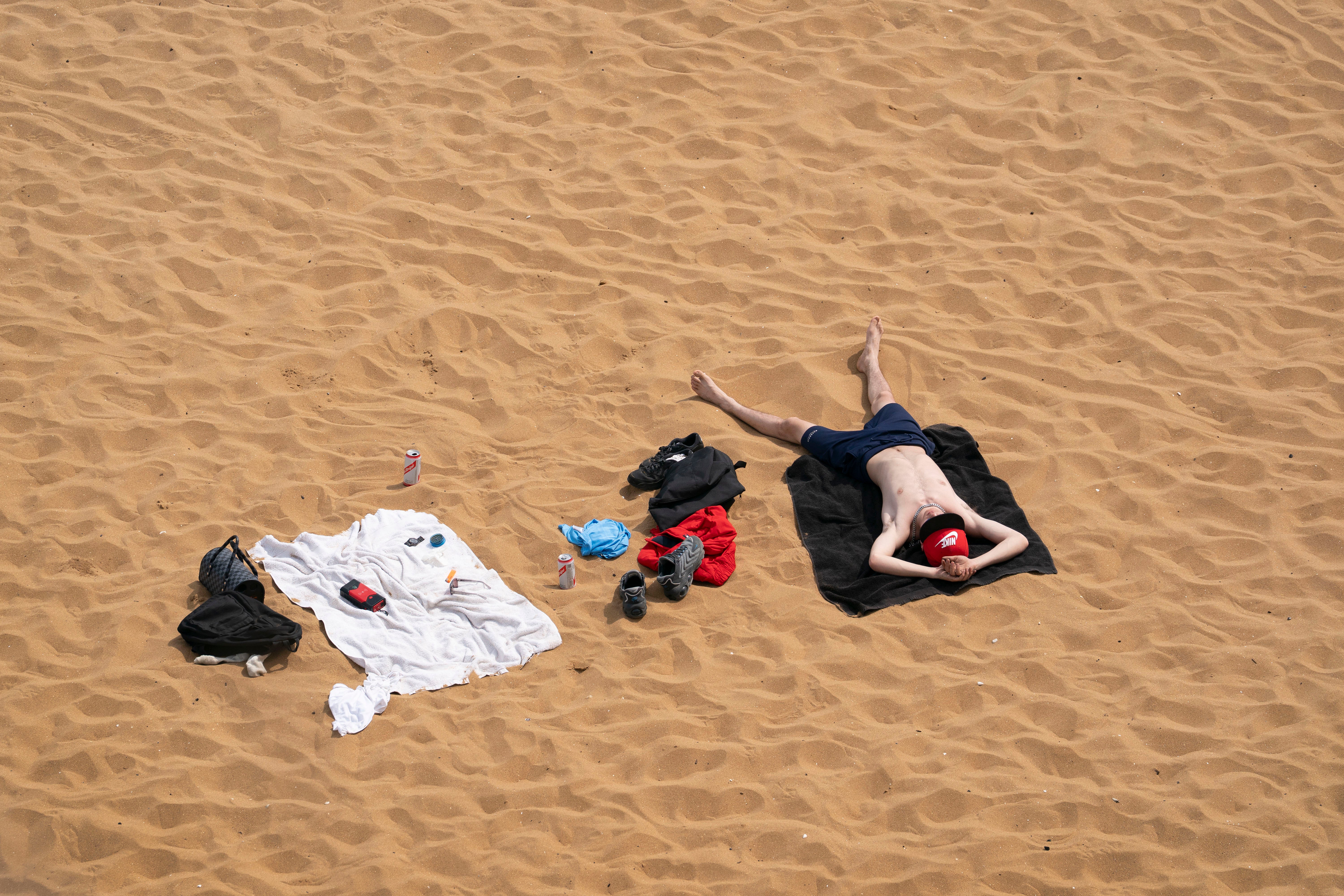 A man relaxes on the beach in Broadstairs, Kent, on May 1