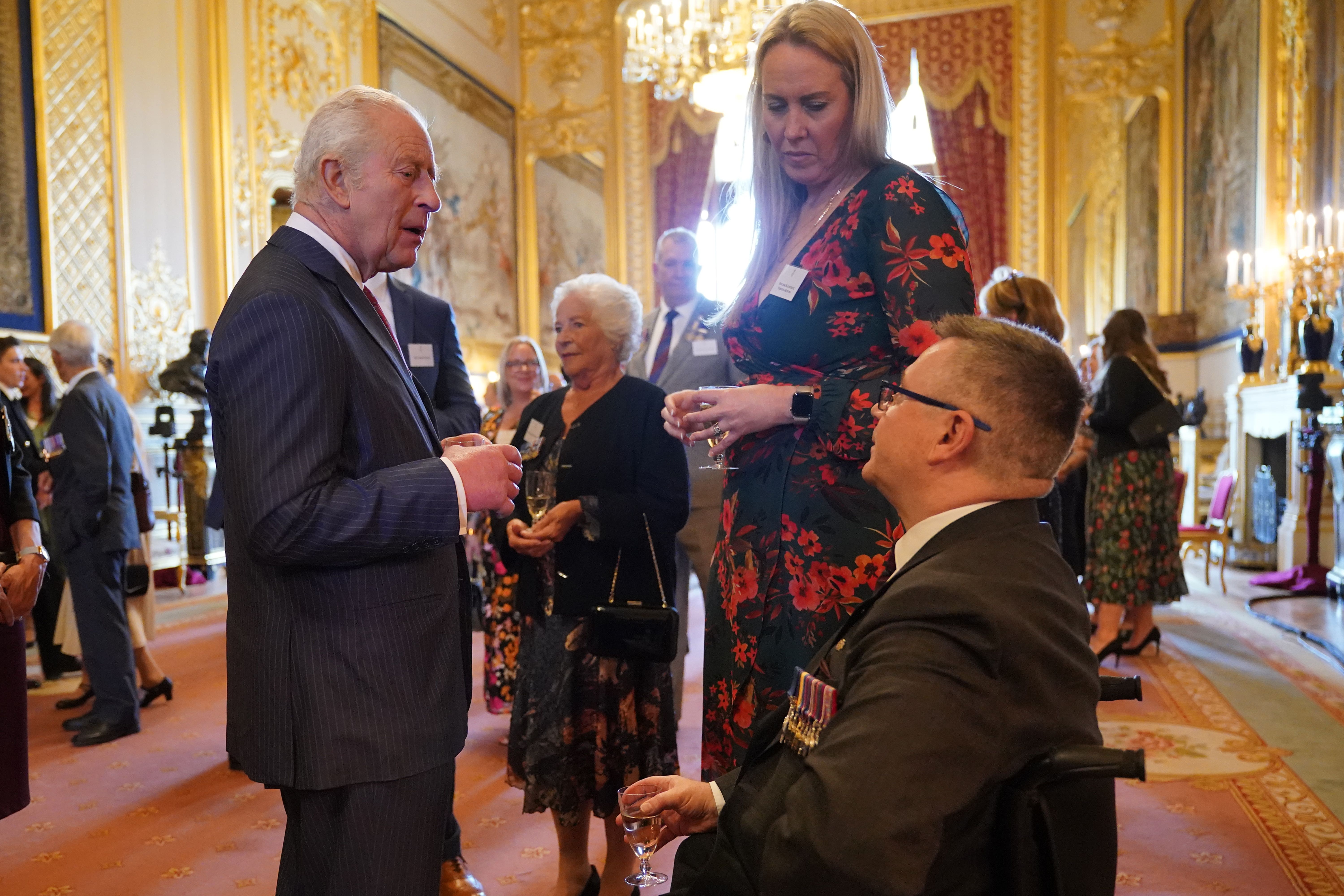 The King talking to Major Peter Norton during a reception for the Victoria Cross and George Cross Association (Yui Mok/PA)
