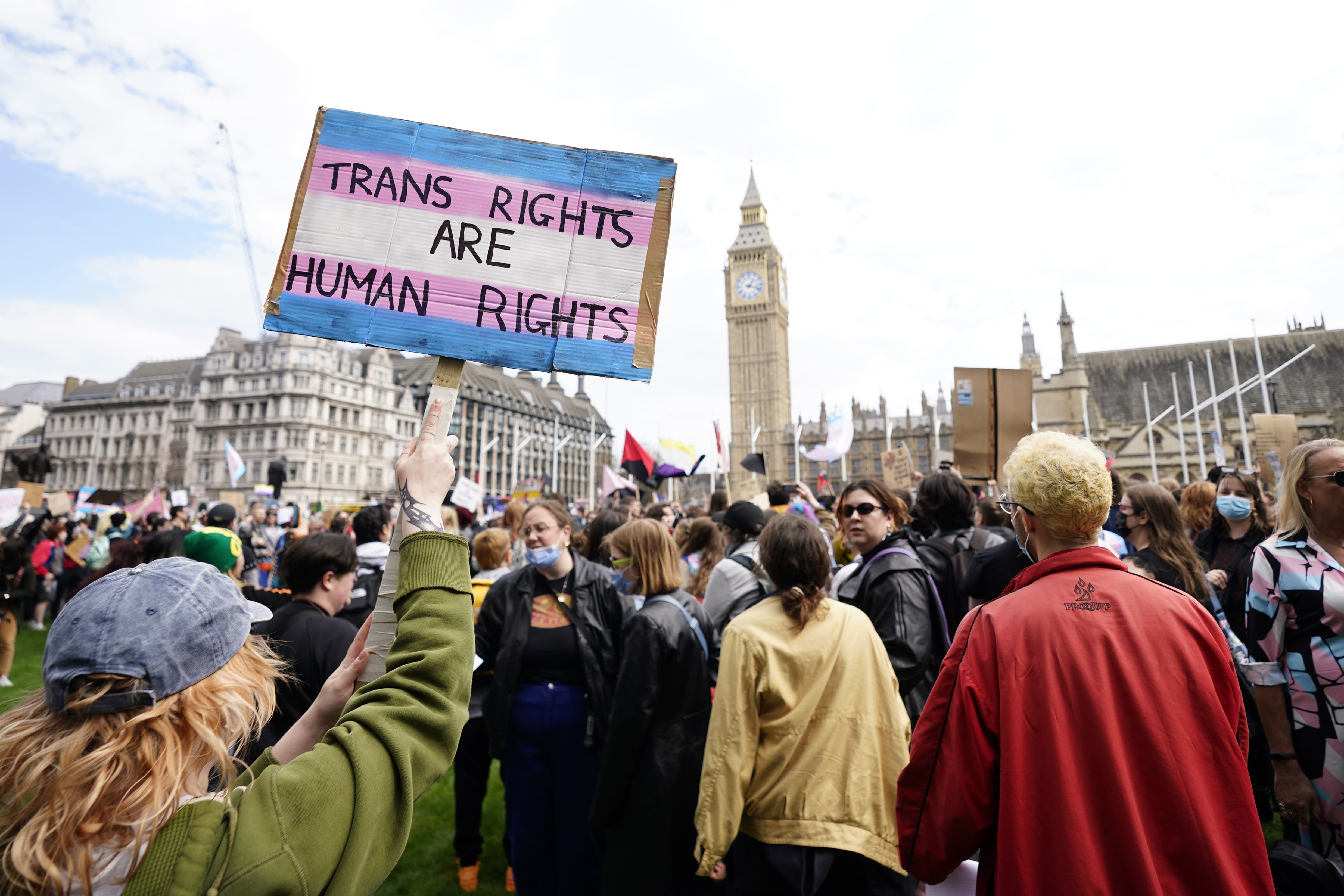 Campaigners take part in a rally organised by trans rights groups, trade unions, and community organisations at Parliament Square (Andrew Matthews/PA)