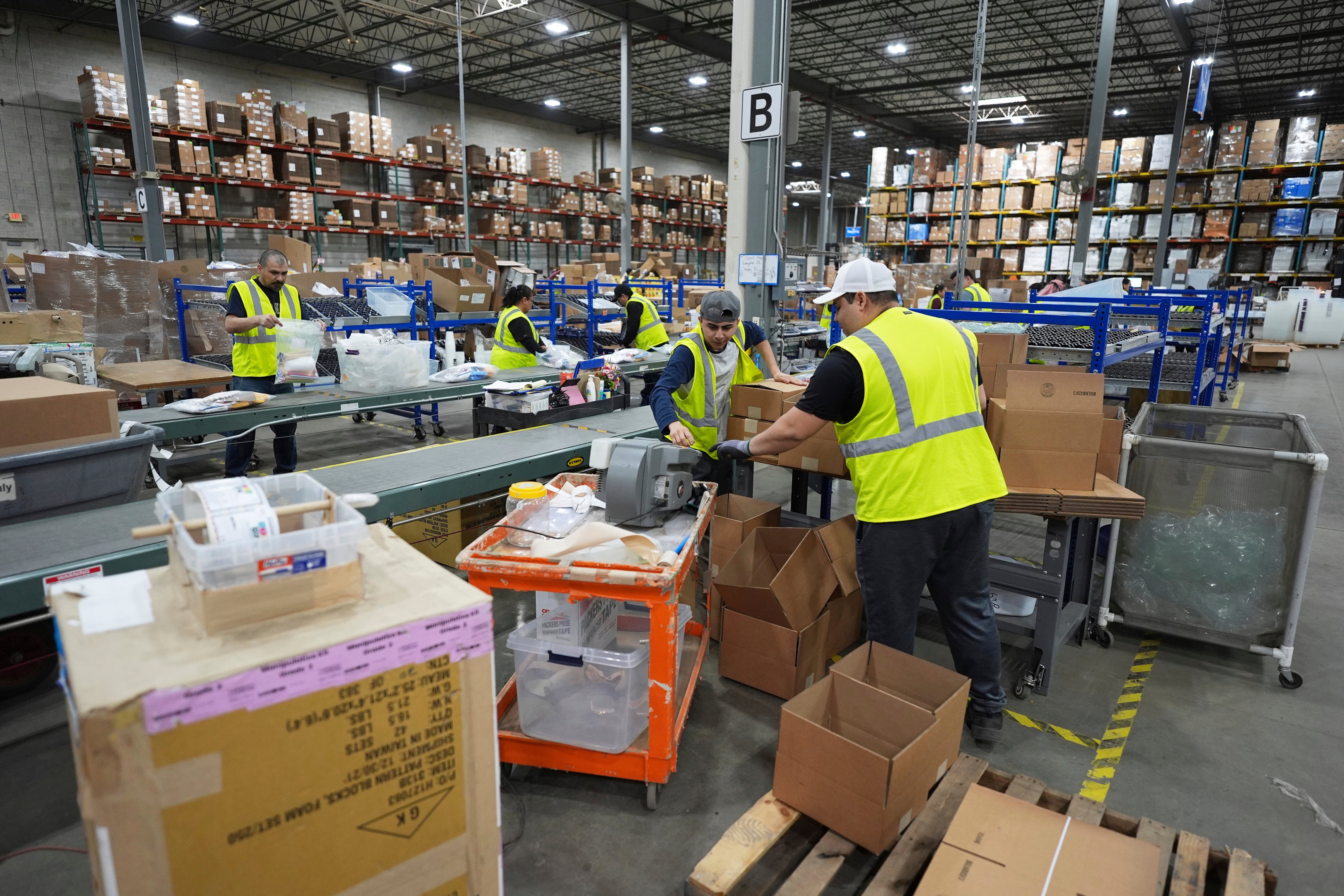 Employees of Learning Resources, an educational toy company, work at a warehouse in Vernon Hills, Ill., Friday, April 11, 2025. (AP Photo/Nam Y. Huh, File)